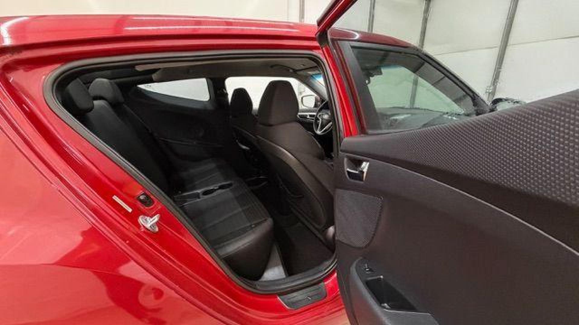 2013 Red Hyundai Veloster Base (KMHTC6ADXDU) with an 1.6L L4 DOHC 16V engine, 6-Speed Automatic transmission, located at 1806 Veterans Memorial Hwy SW, Austell, GA, 30168, (770) 944-9558, 33.817959, -84.606987 - Photo#16