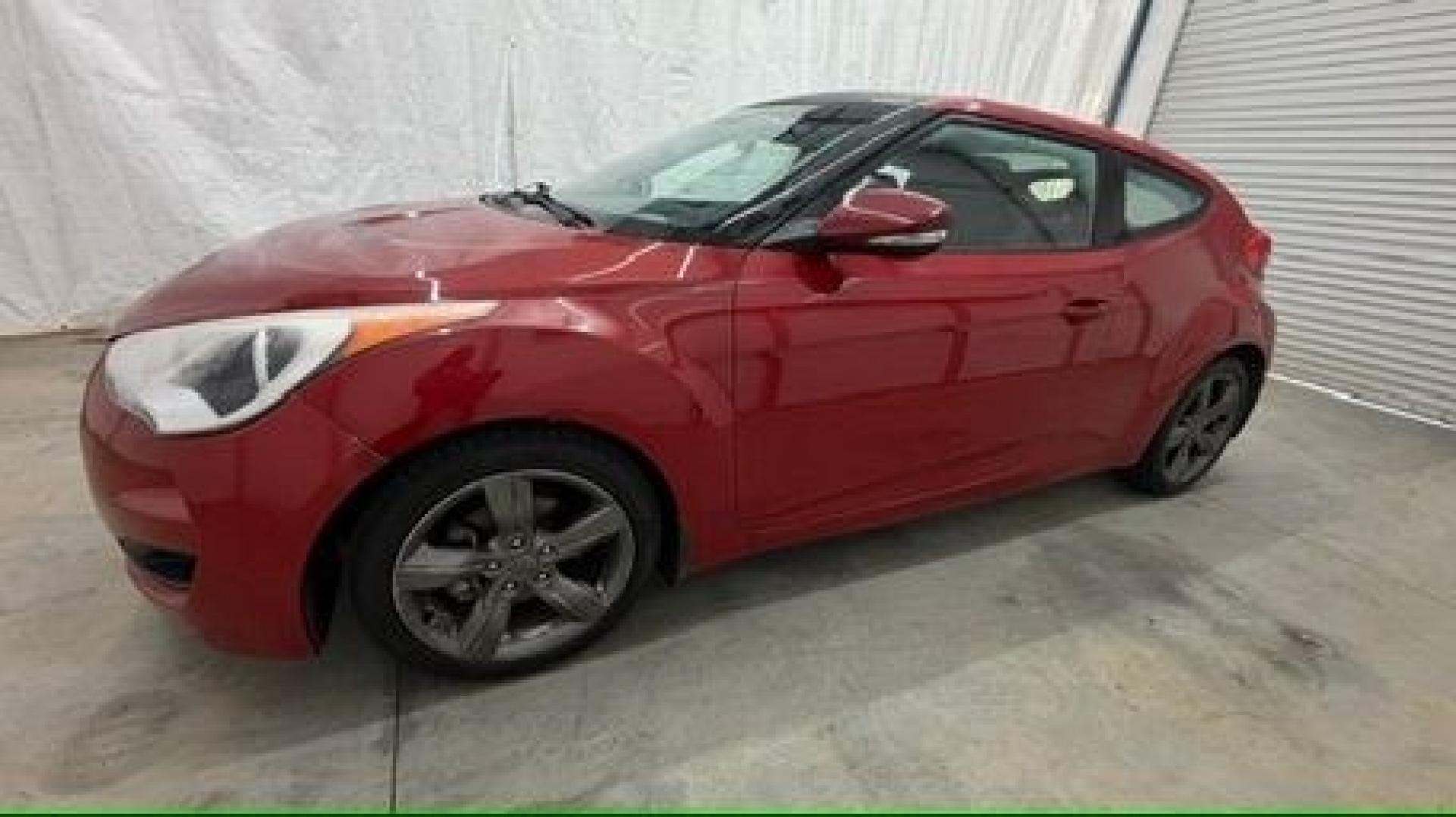 2013 Red Hyundai Veloster Base (KMHTC6ADXDU) with an 1.6L L4 DOHC 16V engine, 6-Speed Automatic transmission, located at 1806 Veterans Memorial Hwy SW, Austell, GA, 30168, (770) 944-9558, 33.817959, -84.606987 - This Veloster is in great overall condition and very clean inside, with a great-looking interior. The driver's seat has a small hole, and the exterior has a few cosmetic scratches, including a small one on the right side door a sporty, head-turning coupe with unique styling.- Photo#1
