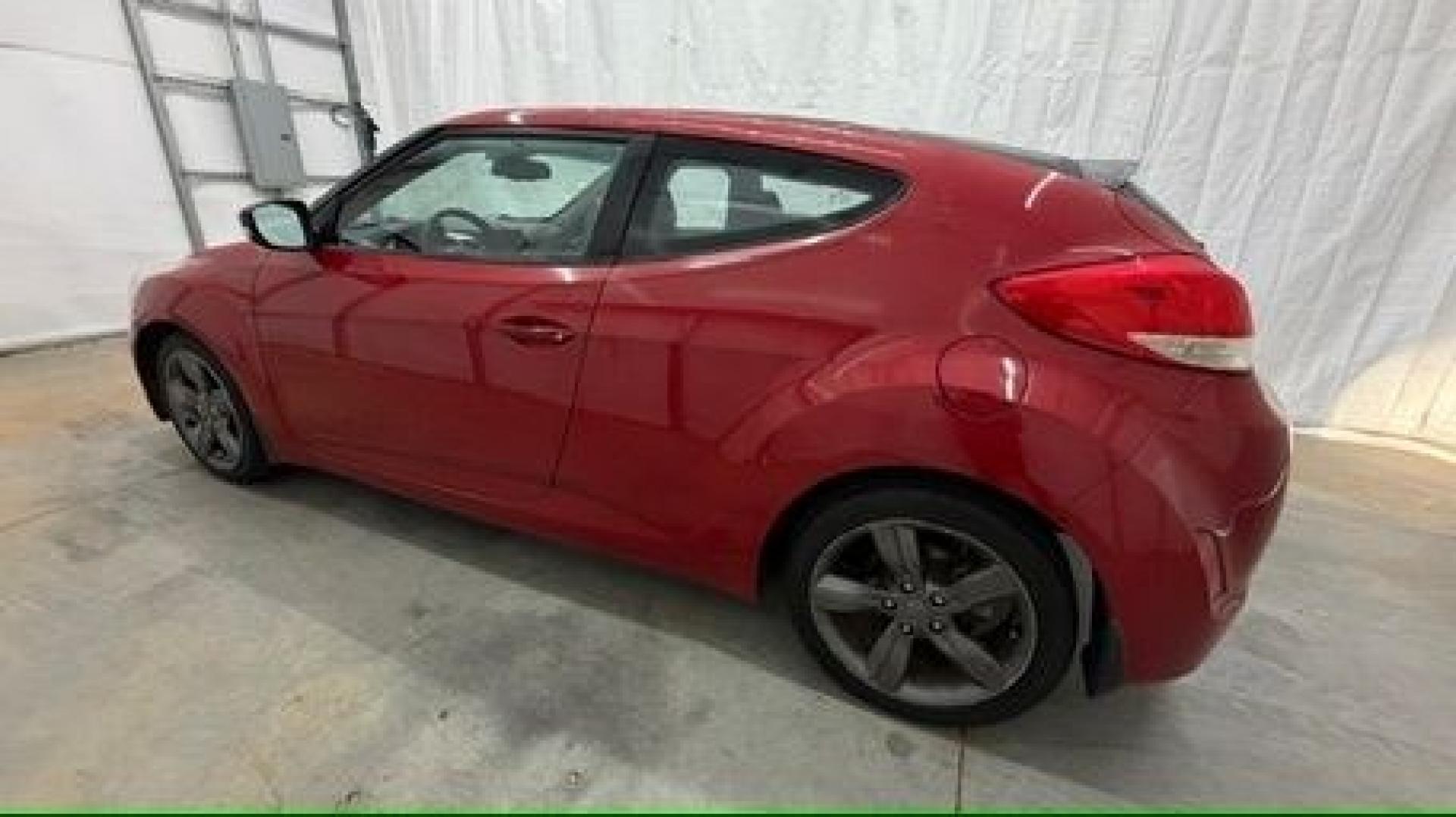 2013 Red Hyundai Veloster Base (KMHTC6ADXDU) with an 1.6L L4 DOHC 16V engine, 6-Speed Automatic transmission, located at 1806 Veterans Memorial Hwy SW, Austell, GA, 30168, (770) 944-9558, 33.817959, -84.606987 - This Veloster is in great overall condition and very clean inside, with a great-looking interior. The driver's seat has a small hole, and the exterior has a few cosmetic scratches, including a small one on the right side door a sporty, head-turning coupe with unique styling.- Photo#2