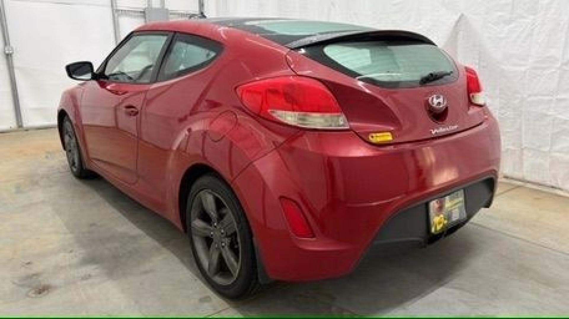 2013 Red Hyundai Veloster Base (KMHTC6ADXDU) with an 1.6L L4 DOHC 16V engine, 6-Speed Automatic transmission, located at 1806 Veterans Memorial Hwy SW, Austell, GA, 30168, (770) 944-9558, 33.817959, -84.606987 - This Veloster is in great overall condition and very clean inside, with a great-looking interior. The driver's seat has a small hole, and the exterior has a few cosmetic scratches, including a small one on the right side door a sporty, head-turning coupe with unique styling.- Photo#16