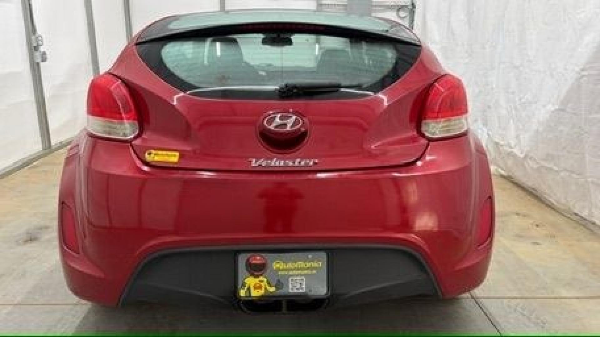 2013 Red Hyundai Veloster Base (KMHTC6ADXDU) with an 1.6L L4 DOHC 16V engine, 6-Speed Automatic transmission, located at 1806 Veterans Memorial Hwy SW, Austell, GA, 30168, (770) 944-9558, 33.817959, -84.606987 - This Veloster is in great overall condition and very clean inside, with a great-looking interior. The driver's seat has a small hole, and the exterior has a few cosmetic scratches, including a small one on the right side door a sporty, head-turning coupe with unique styling.- Photo#3