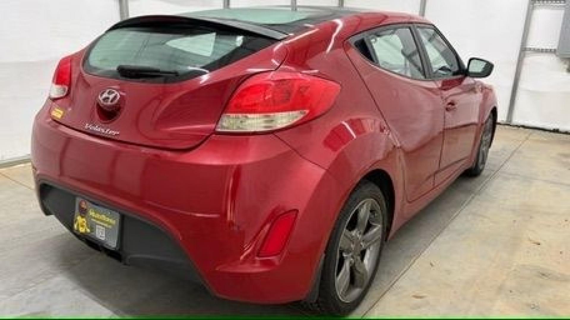 2013 Red Hyundai Veloster Base (KMHTC6ADXDU) with an 1.6L L4 DOHC 16V engine, 6-Speed Automatic transmission, located at 1806 Veterans Memorial Hwy SW, Austell, GA, 30168, (770) 944-9558, 33.817959, -84.606987 - This Veloster is in great overall condition and very clean inside, with a great-looking interior. The driver's seat has a small hole, and the exterior has a few cosmetic scratches, including a small one on the right side door a sporty, head-turning coupe with unique styling.- Photo#4