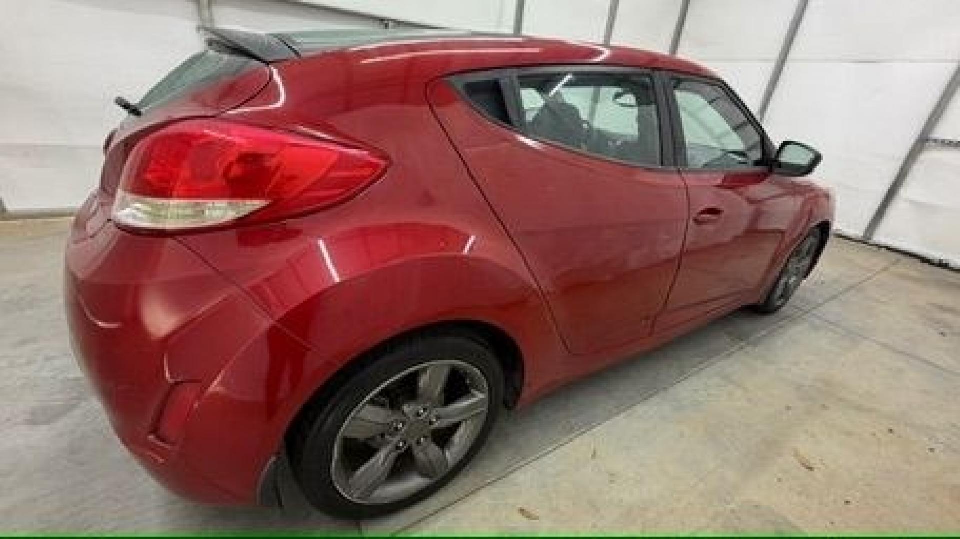 2013 Red Hyundai Veloster Base (KMHTC6ADXDU) with an 1.6L L4 DOHC 16V engine, 6-Speed Automatic transmission, located at 1806 Veterans Memorial Hwy SW, Austell, GA, 30168, (770) 944-9558, 33.817959, -84.606987 - This Veloster is in great overall condition and very clean inside, with a great-looking interior. The driver's seat has a small hole, and the exterior has a few cosmetic scratches, including a small one on the right side door a sporty, head-turning coupe with unique styling.- Photo#5