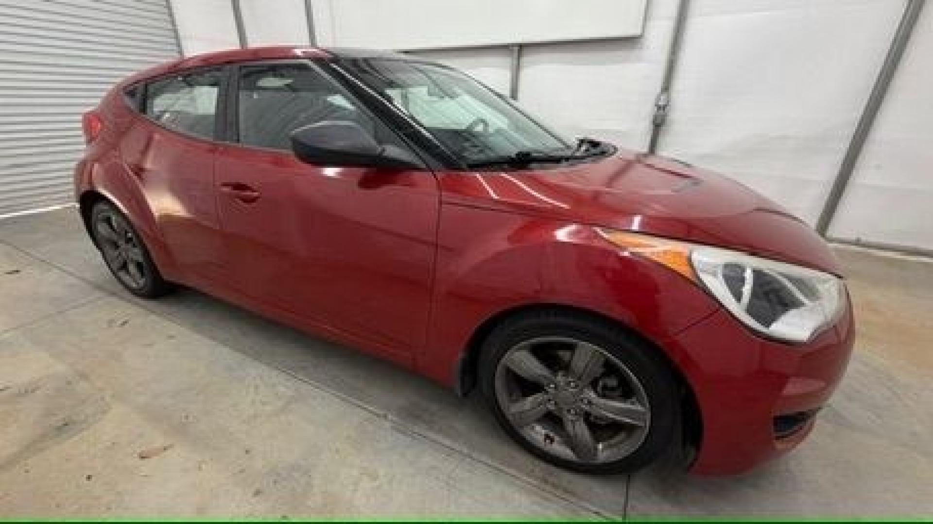 2013 Red Hyundai Veloster Base (KMHTC6ADXDU) with an 1.6L L4 DOHC 16V engine, 6-Speed Automatic transmission, located at 1806 Veterans Memorial Hwy SW, Austell, GA, 30168, (770) 944-9558, 33.817959, -84.606987 - This Veloster is in great overall condition and very clean inside, with a great-looking interior. The driver's seat has a small hole, and the exterior has a few cosmetic scratches, including a small one on the right side door a sporty, head-turning coupe with unique styling.- Photo#6
