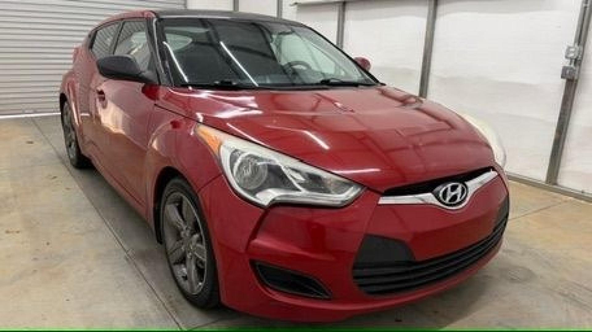 2013 Red Hyundai Veloster Base (KMHTC6ADXDU) with an 1.6L L4 DOHC 16V engine, 6-Speed Automatic transmission, located at 1806 Veterans Memorial Hwy SW, Austell, GA, 30168, (770) 944-9558, 33.817959, -84.606987 - This Veloster is in great overall condition and very clean inside, with a great-looking interior. The driver's seat has a small hole, and the exterior has a few cosmetic scratches, including a small one on the right side door a sporty, head-turning coupe with unique styling.- Photo#7