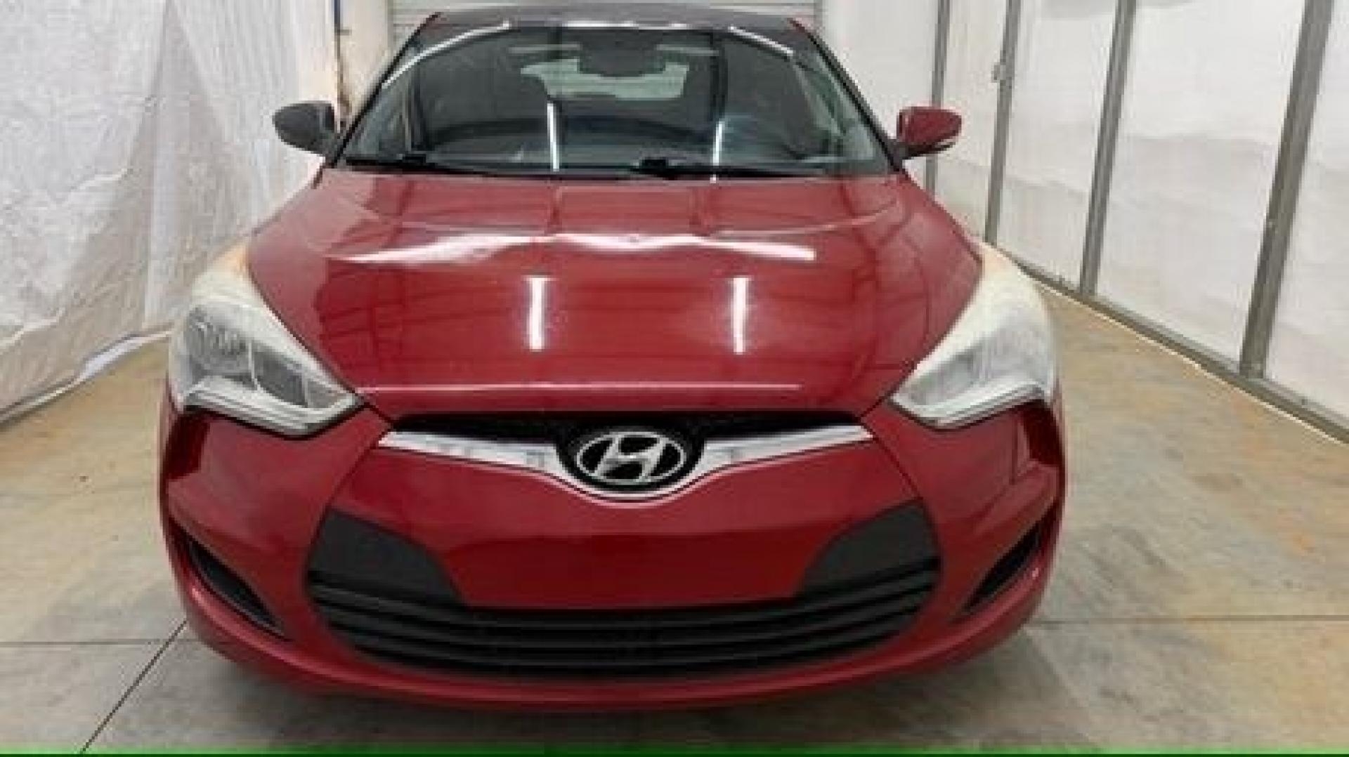 2013 Red Hyundai Veloster Base (KMHTC6ADXDU) with an 1.6L L4 DOHC 16V engine, 6-Speed Automatic transmission, located at 1806 Veterans Memorial Hwy SW, Austell, GA, 30168, (770) 944-9558, 33.817959, -84.606987 - This Veloster is in great overall condition and very clean inside, with a great-looking interior. The driver's seat has a small hole, and the exterior has a few cosmetic scratches, including a small one on the right side door a sporty, head-turning coupe with unique styling.- Photo#8