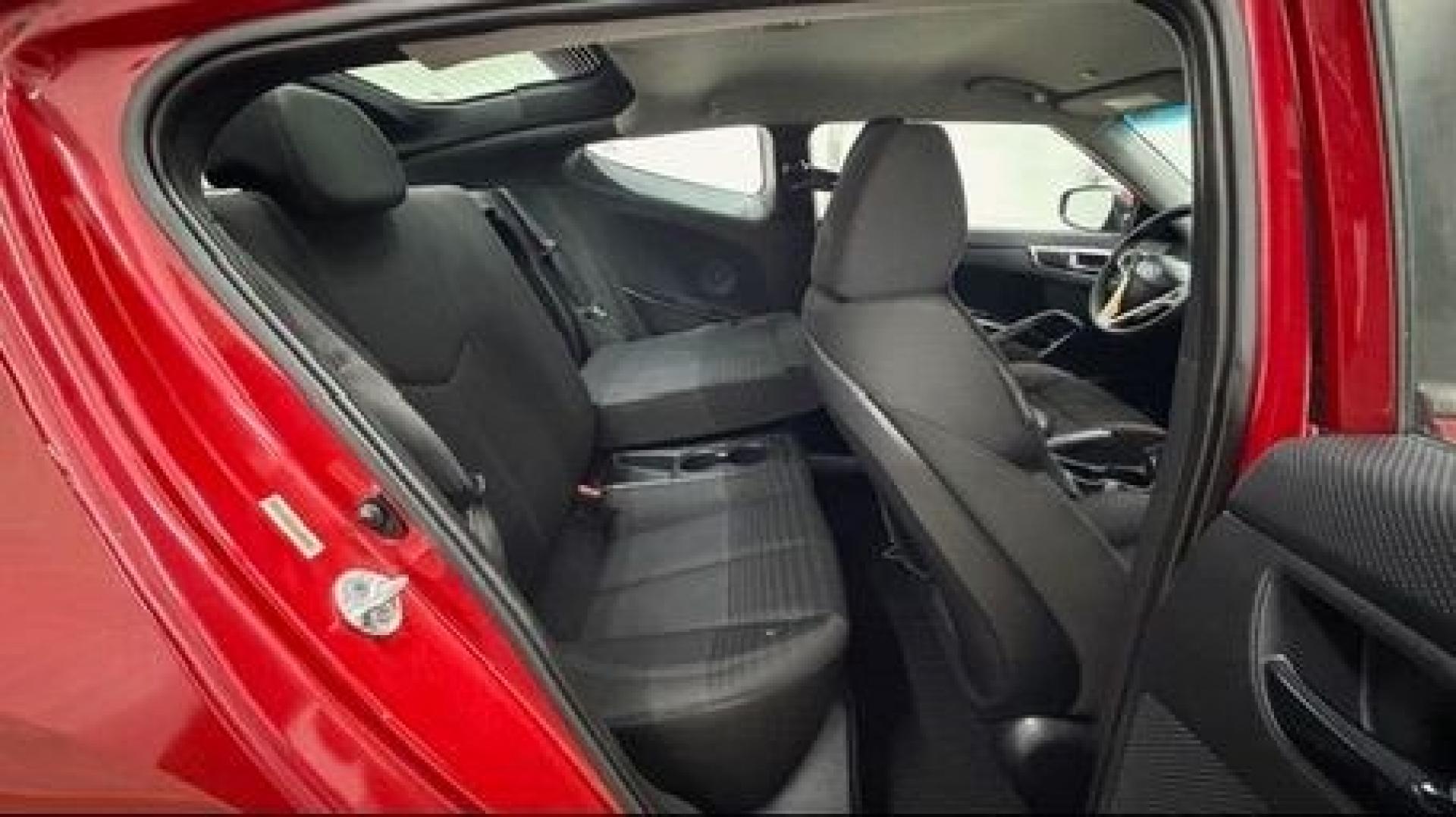 2013 Red Hyundai Veloster Base (KMHTC6ADXDU) with an 1.6L L4 DOHC 16V engine, 6-Speed Automatic transmission, located at 1806 Veterans Memorial Hwy SW, Austell, GA, 30168, (770) 944-9558, 33.817959, -84.606987 - This Veloster is in great overall condition and very clean inside, with a great-looking interior. The driver's seat has a small hole, and the exterior has a few cosmetic scratches, including a small one on the right side door a sporty, head-turning coupe with unique styling.- Photo#12