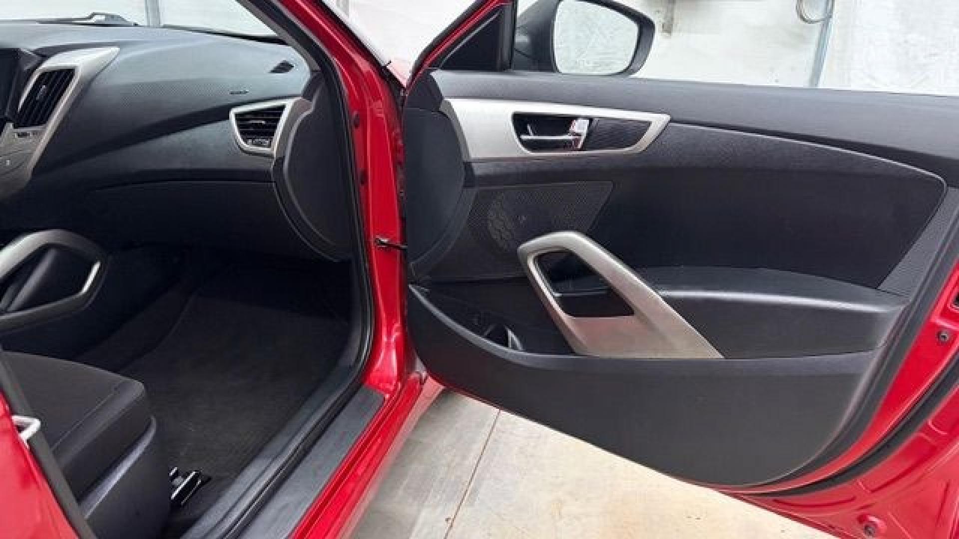 2013 Red Hyundai Veloster Base (KMHTC6ADXDU) with an 1.6L L4 DOHC 16V engine, 6-Speed Automatic transmission, located at 1806 Veterans Memorial Hwy SW, Austell, GA, 30168, (770) 944-9558, 33.817959, -84.606987 - This Veloster is in great overall condition and very clean inside, with a great-looking interior. The driver's seat has a small hole, and the exterior has a few cosmetic scratches, including a small one on the right side door a sporty, head-turning coupe with unique styling.- Photo#13