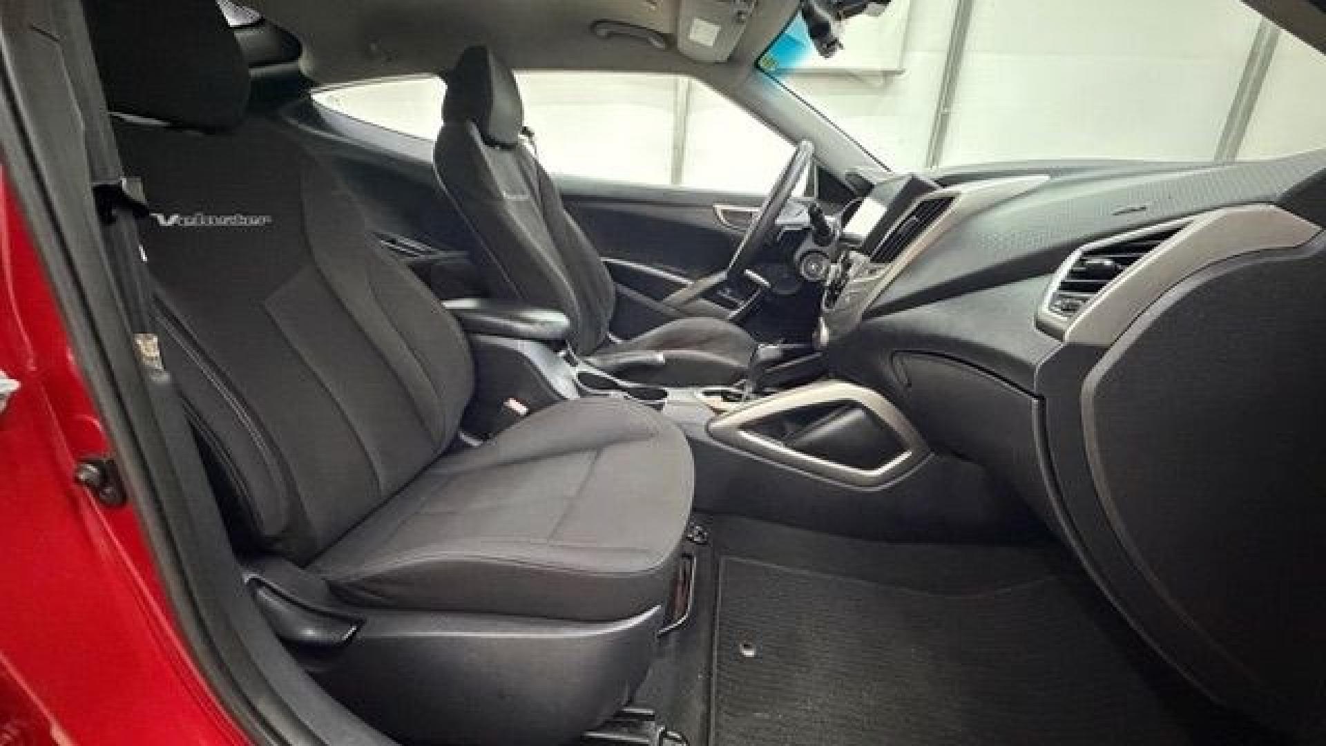 2013 Red Hyundai Veloster Base (KMHTC6ADXDU) with an 1.6L L4 DOHC 16V engine, 6-Speed Automatic transmission, located at 1806 Veterans Memorial Hwy SW, Austell, GA, 30168, (770) 944-9558, 33.817959, -84.606987 - This Veloster is in great overall condition and very clean inside, with a great-looking interior. The driver's seat has a small hole, and the exterior has a few cosmetic scratches, including a small one on the right side door a sporty, head-turning coupe with unique styling.- Photo#14