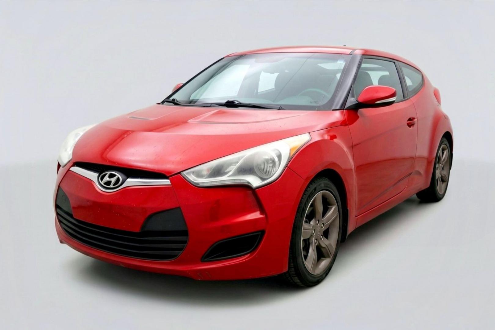 2013 Red Hyundai Veloster Base (KMHTC6ADXDU) with an 1.6L L4 DOHC 16V engine, 6-Speed Automatic transmission, located at 1806 Veterans Memorial Hwy SW, Austell, GA, 30168, (770) 944-9558, 33.817959, -84.606987 - This Veloster is in great overall condition and very clean inside, with a great-looking interior. The driver's seat has a small hole, and the exterior has a few cosmetic scratches, including a small one on the right side door a sporty, head-turning coupe with unique styling.- Photo#0