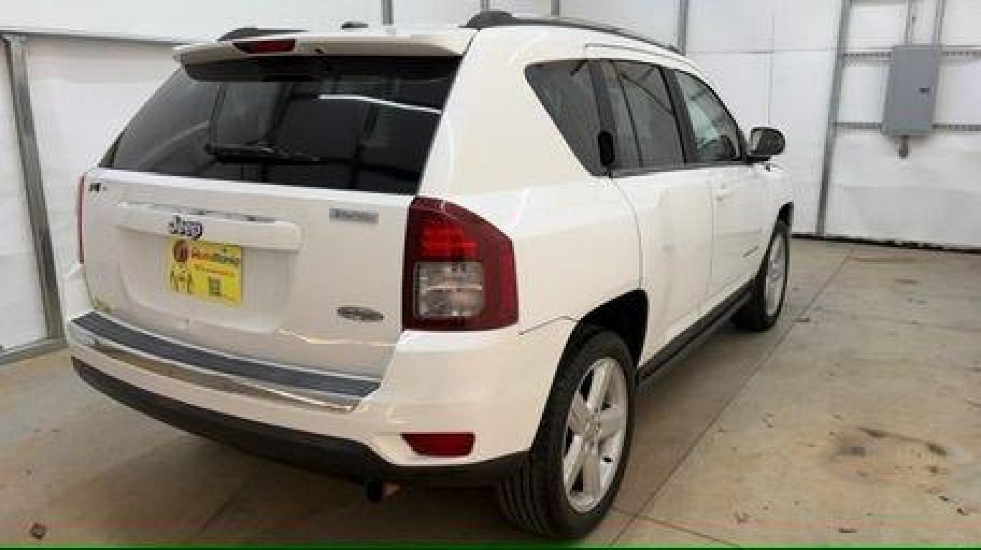 2014 White Jeep Compass Latitude FWD (1C4NJCEAXED) with an 2.0L L4 DOHC 16V engine, Continuously Variabl transmission, located at 1806 Veterans Memorial Hwy SW, Austell, GA, 30168, (770) 944-9558, 33.817959, -84.606987 - Photo#5