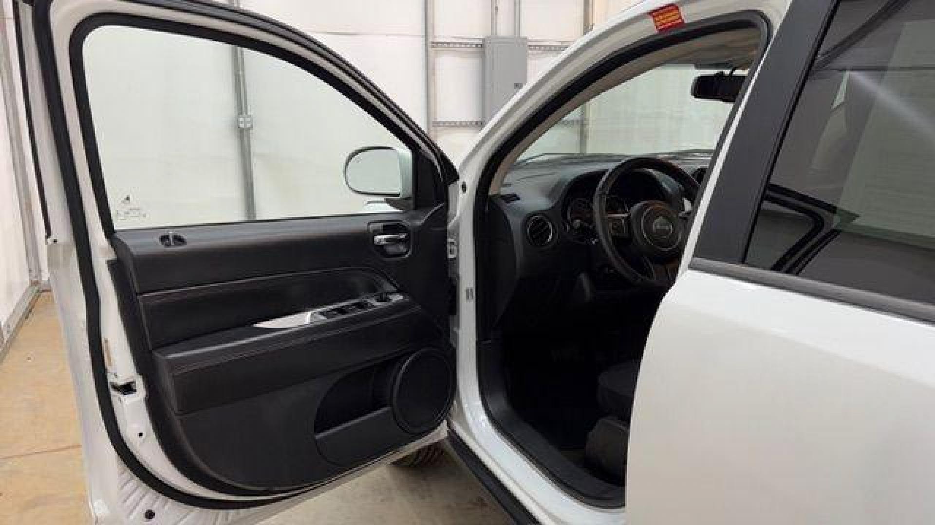 2014 White Jeep Compass Latitude FWD (1C4NJCEAXED) with an 2.0L L4 DOHC 16V engine, Continuously Variabl transmission, located at 1806 Veterans Memorial Hwy SW, Austell, GA, 30168, (770) 944-9558, 33.817959, -84.606987 - Photo#10