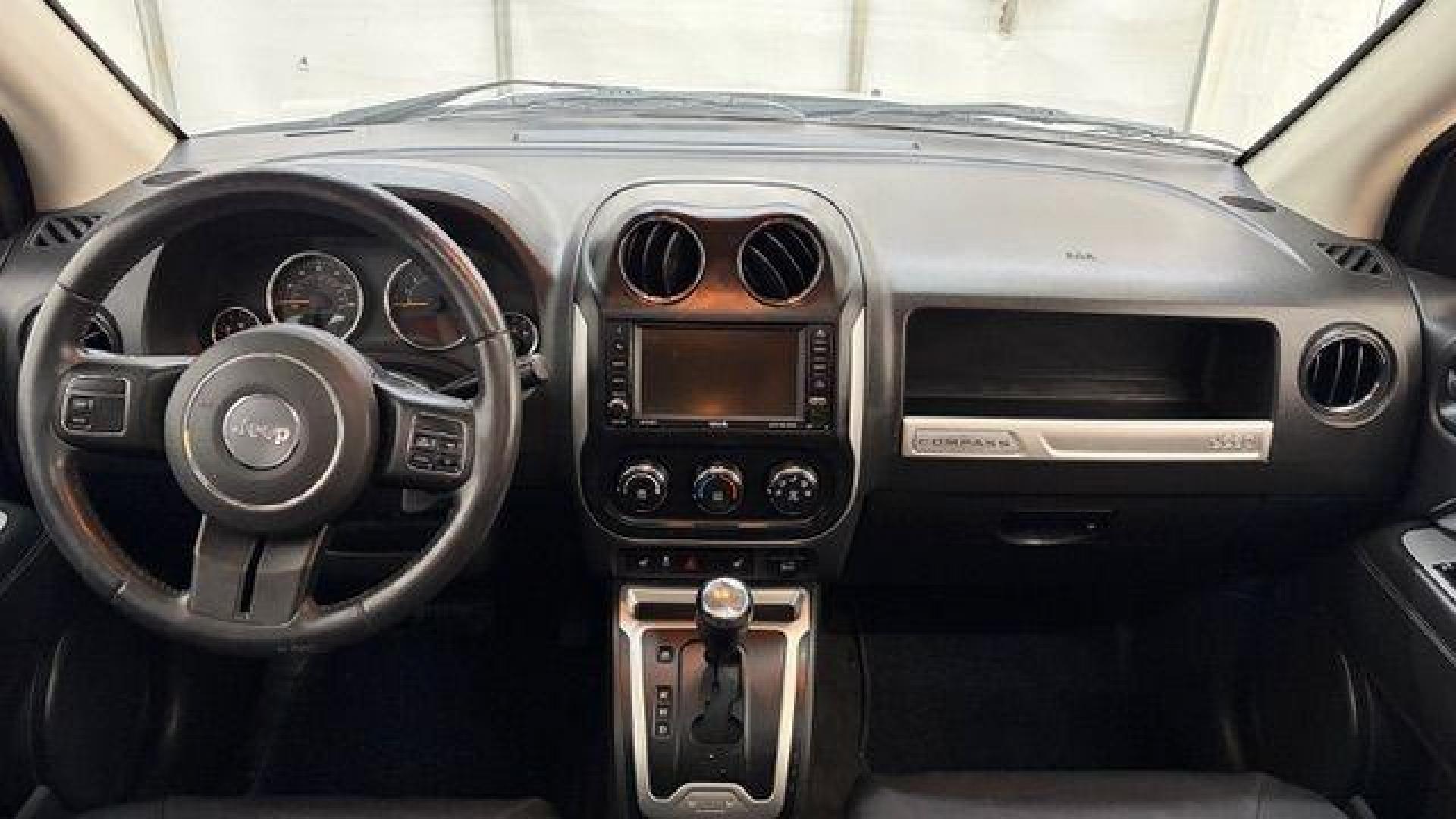 2014 White Jeep Compass Latitude FWD (1C4NJCEAXED) with an 2.0L L4 DOHC 16V engine, Continuously Variabl transmission, located at 1806 Veterans Memorial Hwy SW, Austell, GA, 30168, (770) 944-9558, 33.817959, -84.606987 - Photo#15