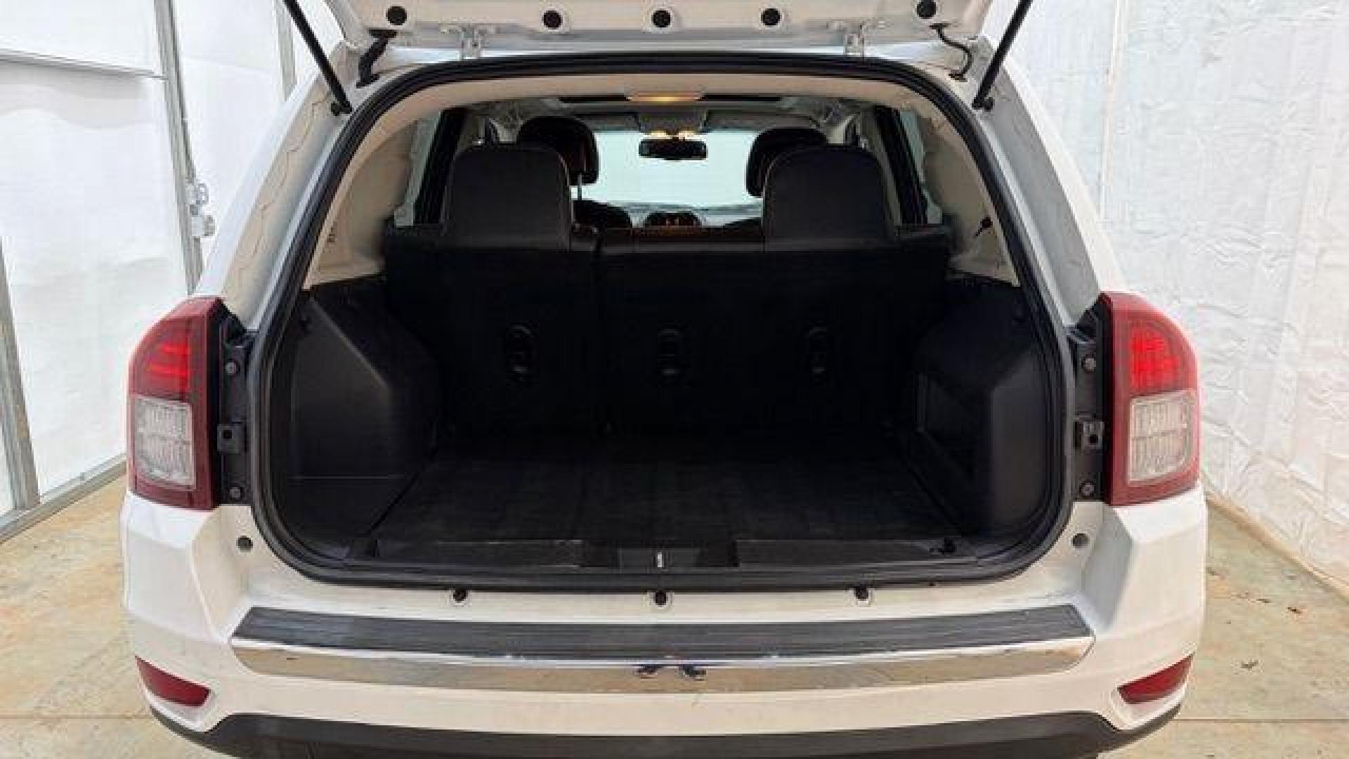 2014 White Jeep Compass Latitude FWD (1C4NJCEAXED) with an 2.0L L4 DOHC 16V engine, Continuously Variabl transmission, located at 1806 Veterans Memorial Hwy SW, Austell, GA, 30168, (770) 944-9558, 33.817959, -84.606987 - Photo#16