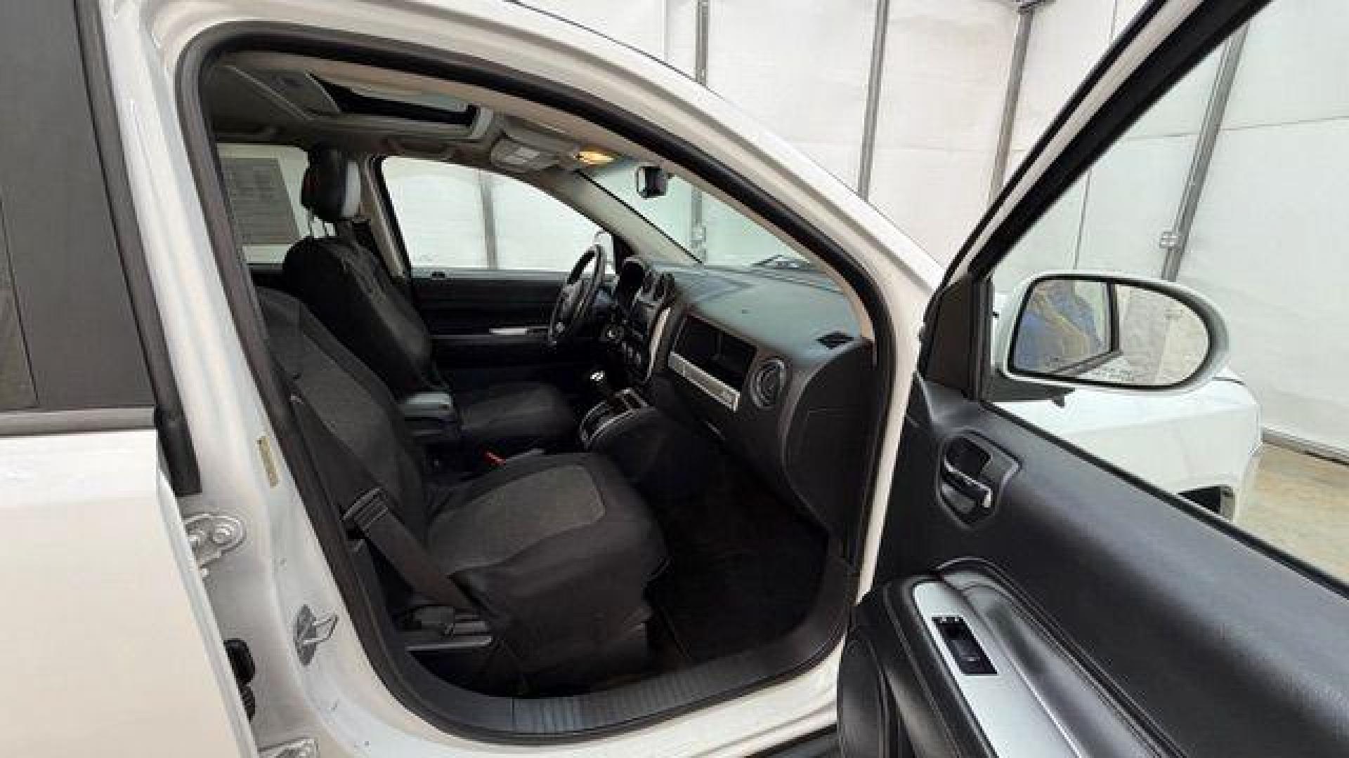 2014 White Jeep Compass Latitude FWD (1C4NJCEAXED) with an 2.0L L4 DOHC 16V engine, Continuously Variabl transmission, located at 1806 Veterans Memorial Hwy SW, Austell, GA, 30168, (770) 944-9558, 33.817959, -84.606987 - Photo#18