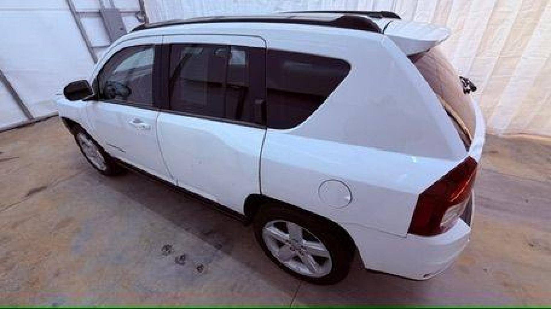 2014 White Jeep Compass Latitude FWD (1C4NJCEAXED) with an 2.0L L4 DOHC 16V engine, Continuously Variabl transmission, located at 1806 Veterans Memorial Hwy SW, Austell, GA, 30168, (770) 944-9558, 33.817959, -84.606987 - Photo#2