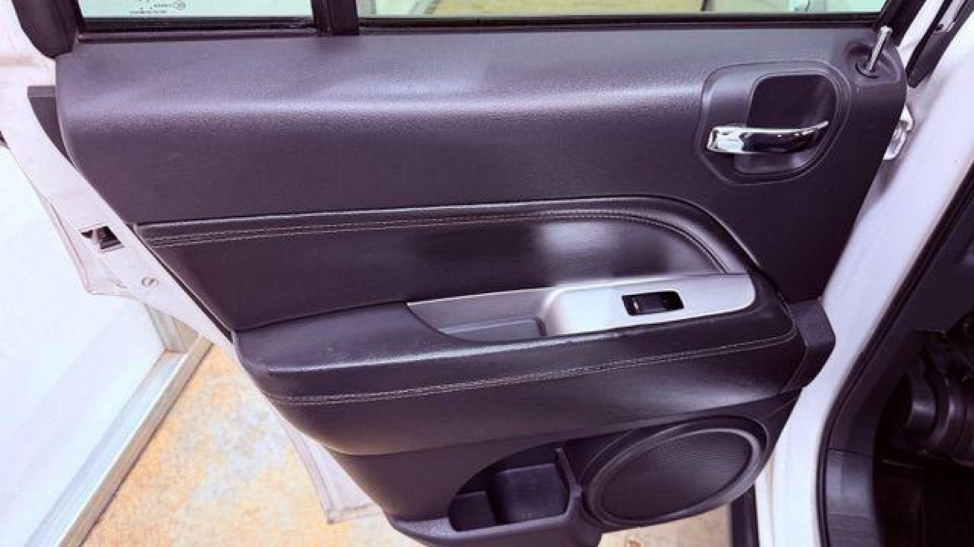 2014 White Jeep Compass Latitude FWD (1C4NJCEAXED) with an 2.0L L4 DOHC 16V engine, Continuously Variabl transmission, located at 1806 Veterans Memorial Hwy SW, Austell, GA, 30168, (770) 944-9558, 33.817959, -84.606987 - Photo#13