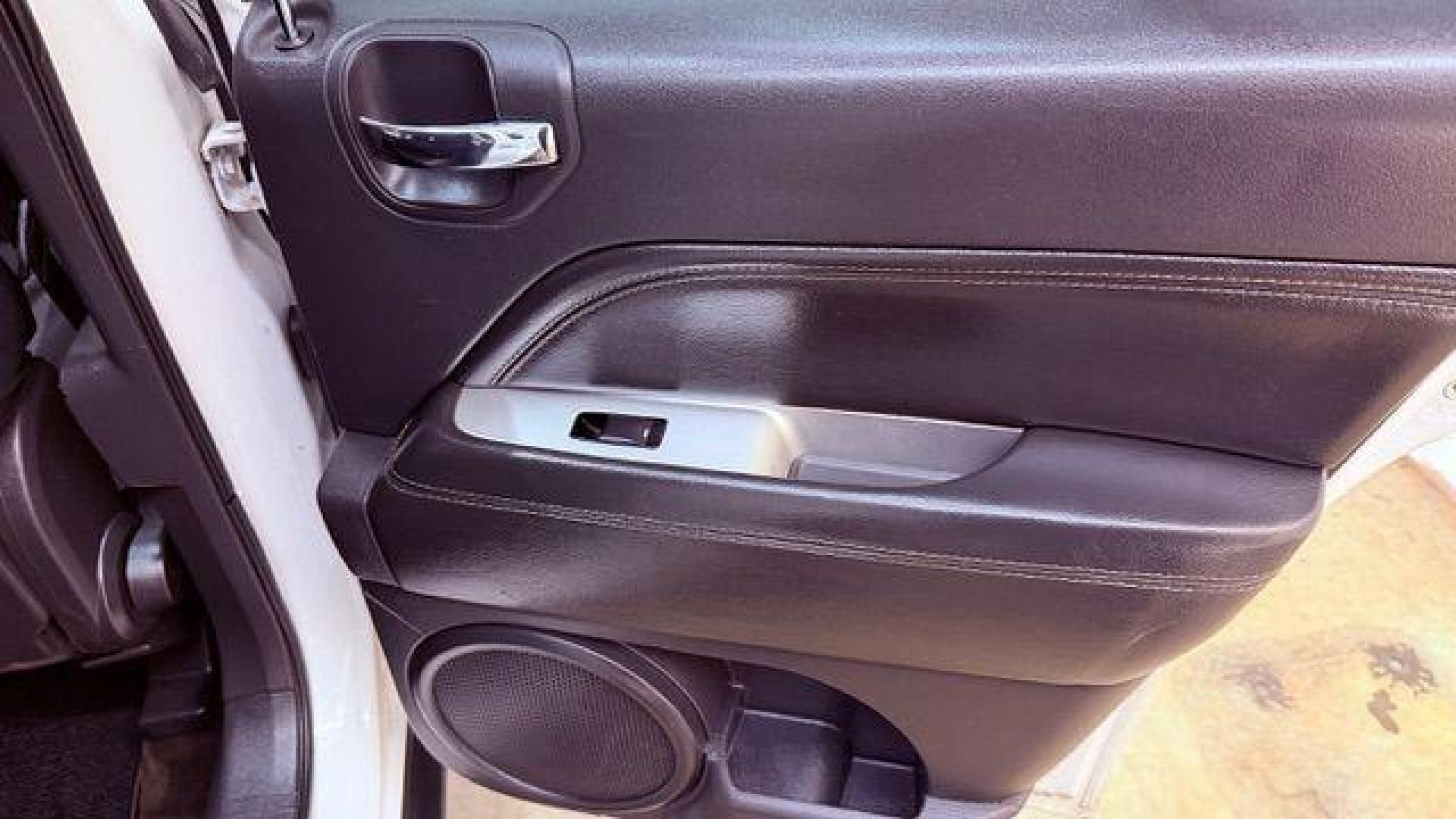 2014 White Jeep Compass Latitude FWD (1C4NJCEAXED) with an 2.0L L4 DOHC 16V engine, Continuously Variabl transmission, located at 1806 Veterans Memorial Hwy SW, Austell, GA, 30168, (770) 944-9558, 33.817959, -84.606987 - Photo#16