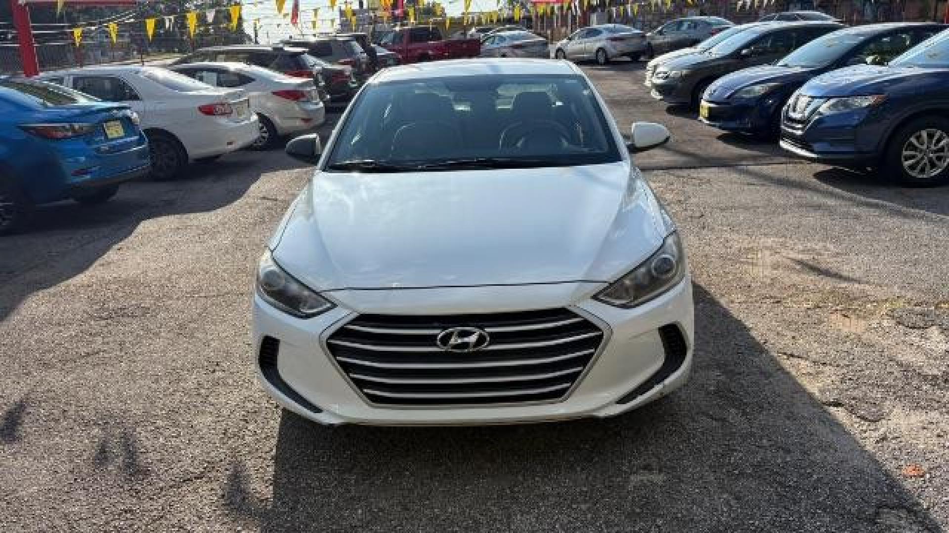 2017 White Hyundai Elantra SE 6AT (5NPD74LF3HH) with an 1.8L L4 DOHC 16V engine, 6-Speed Automatic transmission, located at 1806 Veterans Memorial Hwy SW, Austell, GA, 30168, (770) 944-9558, 33.817959, -84.606987 - Photo#1