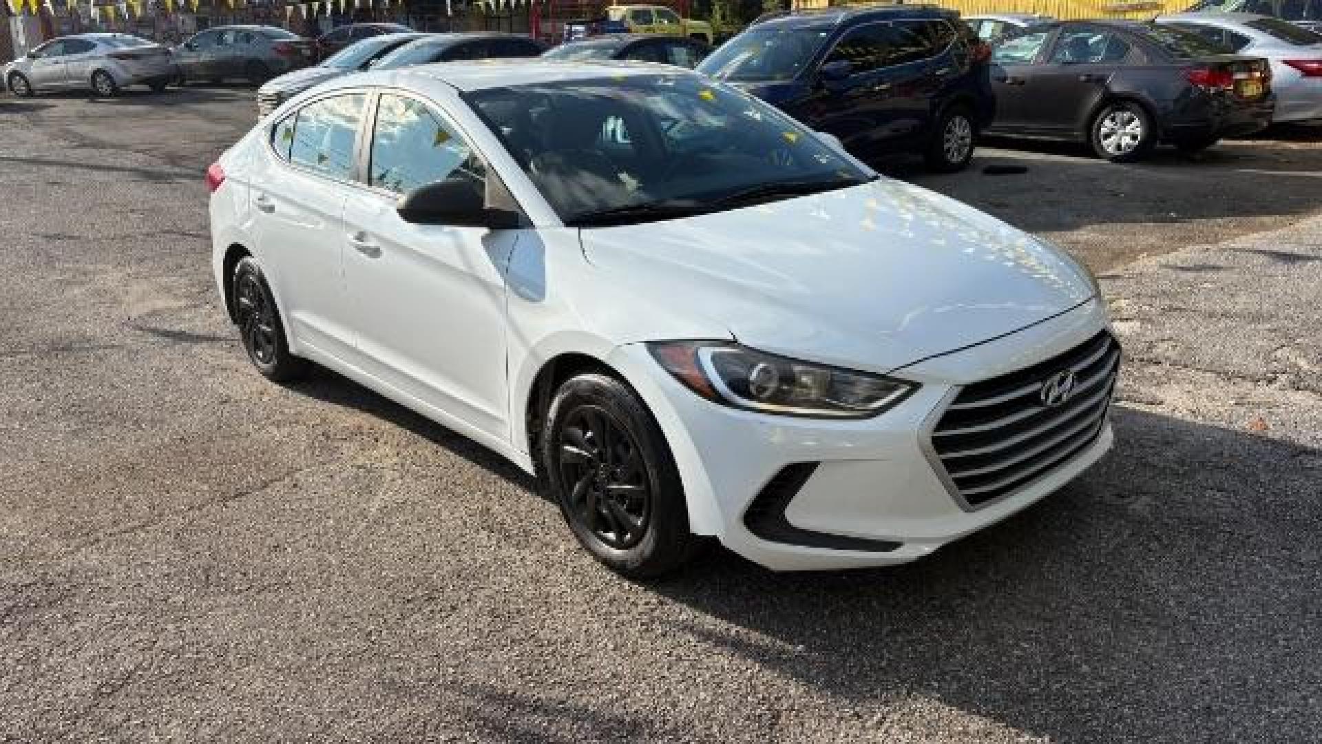 2017 White Hyundai Elantra SE 6AT (5NPD74LF3HH) with an 1.8L L4 DOHC 16V engine, 6-Speed Automatic transmission, located at 1806 Veterans Memorial Hwy SW, Austell, GA, 30168, (770) 944-9558, 33.817959, -84.606987 - Photo#2