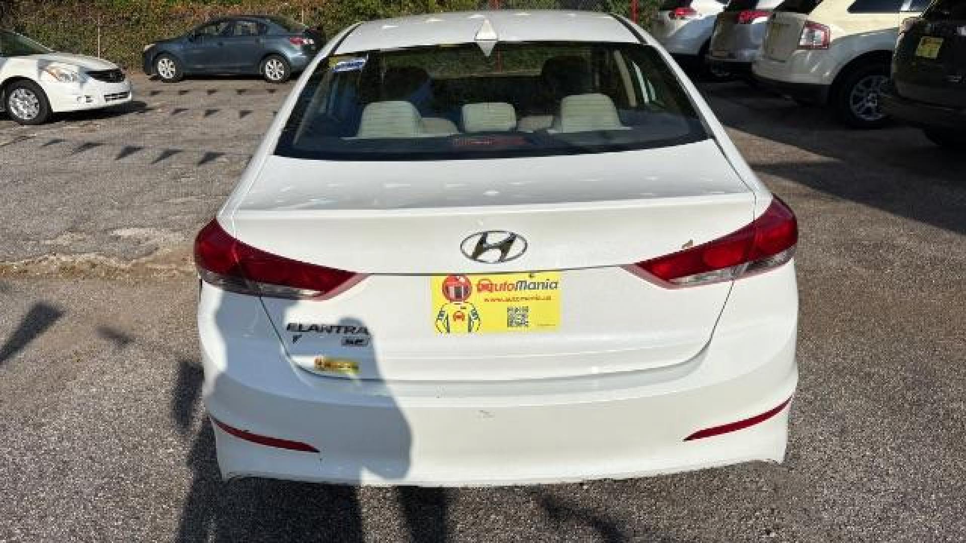 2017 White Hyundai Elantra SE 6AT (5NPD74LF3HH) with an 1.8L L4 DOHC 16V engine, 6-Speed Automatic transmission, located at 1806 Veterans Memorial Hwy SW, Austell, GA, 30168, (770) 944-9558, 33.817959, -84.606987 - Photo#3