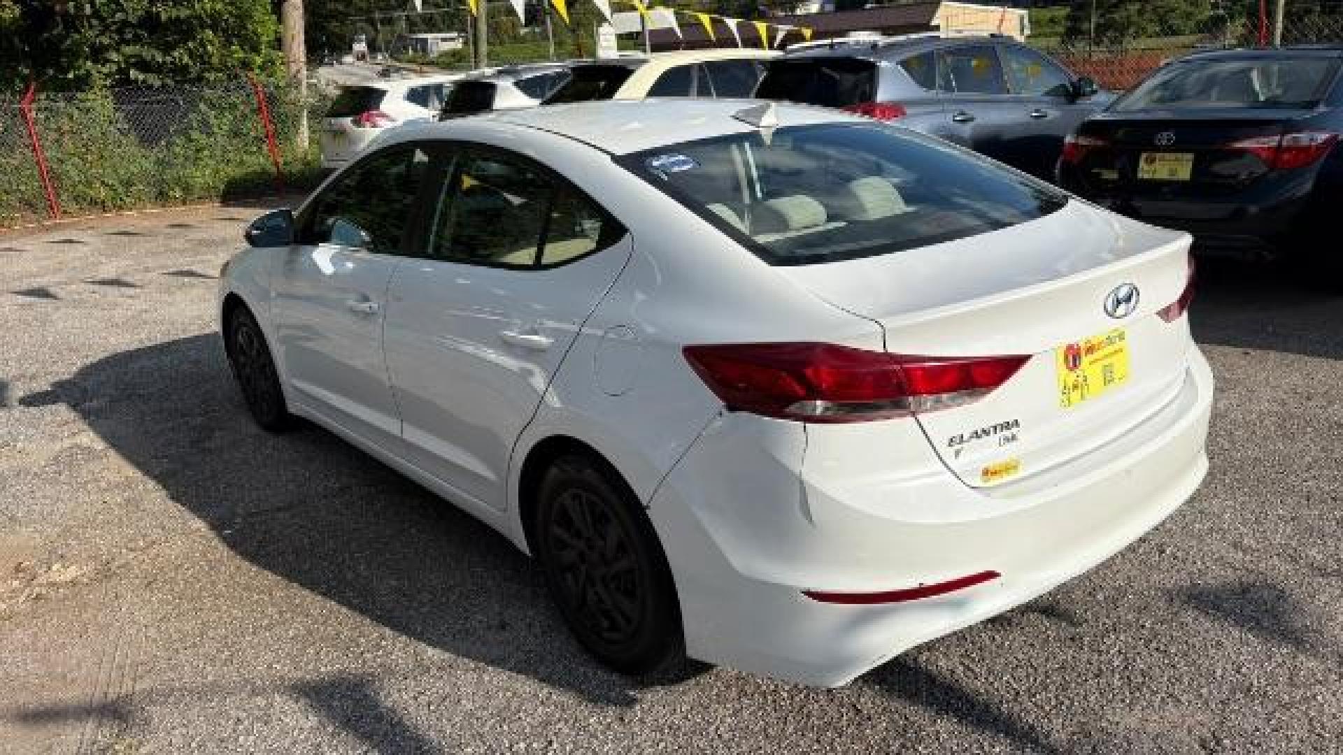 2017 White Hyundai Elantra SE 6AT (5NPD74LF3HH) with an 1.8L L4 DOHC 16V engine, 6-Speed Automatic transmission, located at 1806 Veterans Memorial Hwy SW, Austell, GA, 30168, (770) 944-9558, 33.817959, -84.606987 - Photo#4