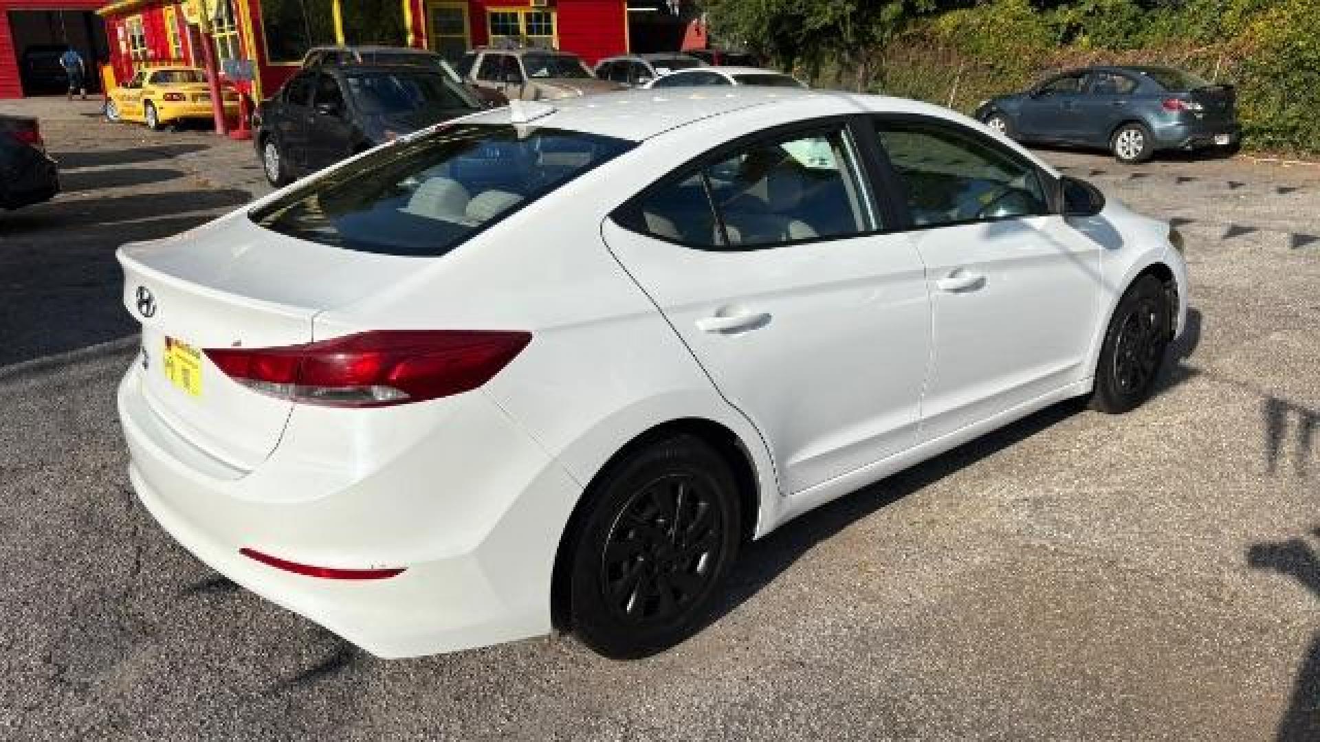 2017 White Hyundai Elantra SE 6AT (5NPD74LF3HH) with an 1.8L L4 DOHC 16V engine, 6-Speed Automatic transmission, located at 1806 Veterans Memorial Hwy SW, Austell, GA, 30168, (770) 944-9558, 33.817959, -84.606987 - Photo#5