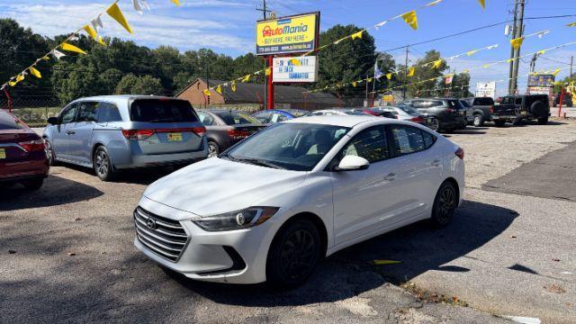 2017 White Hyundai Elantra SE 6AT (5NPD74LF3HH) with an 1.8L L4 DOHC 16V engine, 6-Speed Automatic transmission, located at 1806 Veterans Memorial Hwy SW, Austell, GA, 30168, (770) 944-9558, 33.817959, -84.606987 - Photo#0
