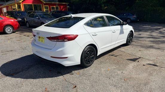 2017 White Hyundai Elantra SE 6AT (5NPD74LF3HH) with an 1.8L L4 DOHC 16V engine, 6-Speed Automatic transmission, located at 1806 Veterans Memorial Hwy SW, Austell, GA, 30168, (770) 944-9558, 33.817959, -84.606987 - Photo#3
