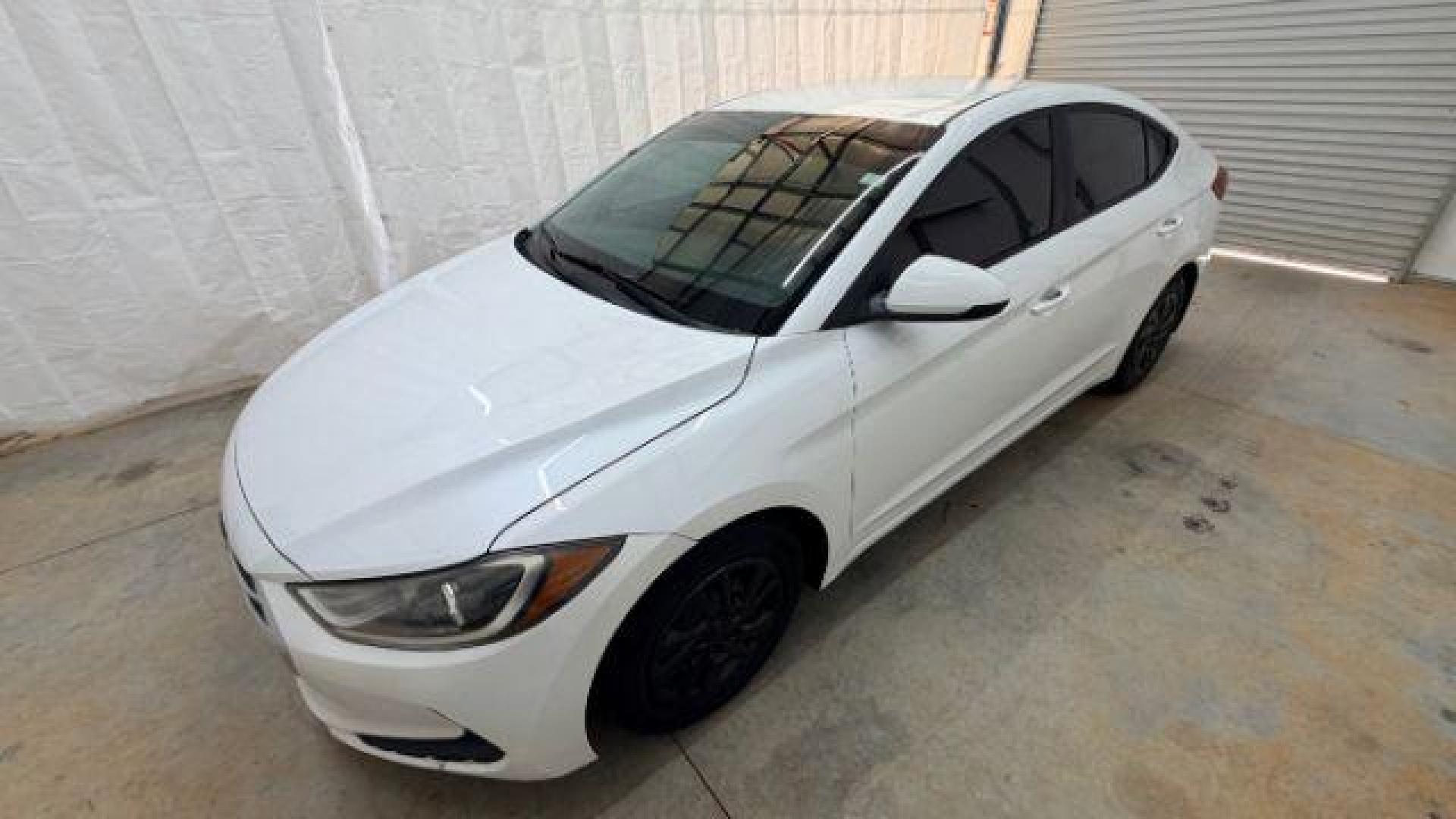 2017 White Hyundai Elantra SE 6AT (5NPD74LF3HH) with an 1.8L L4 DOHC 16V engine, 6-Speed Automatic transmission, located at 1806 Veterans Memorial Hwy SW, Austell, GA, 30168, (770) 944-9558, 33.817959, -84.606987 - Photo#1