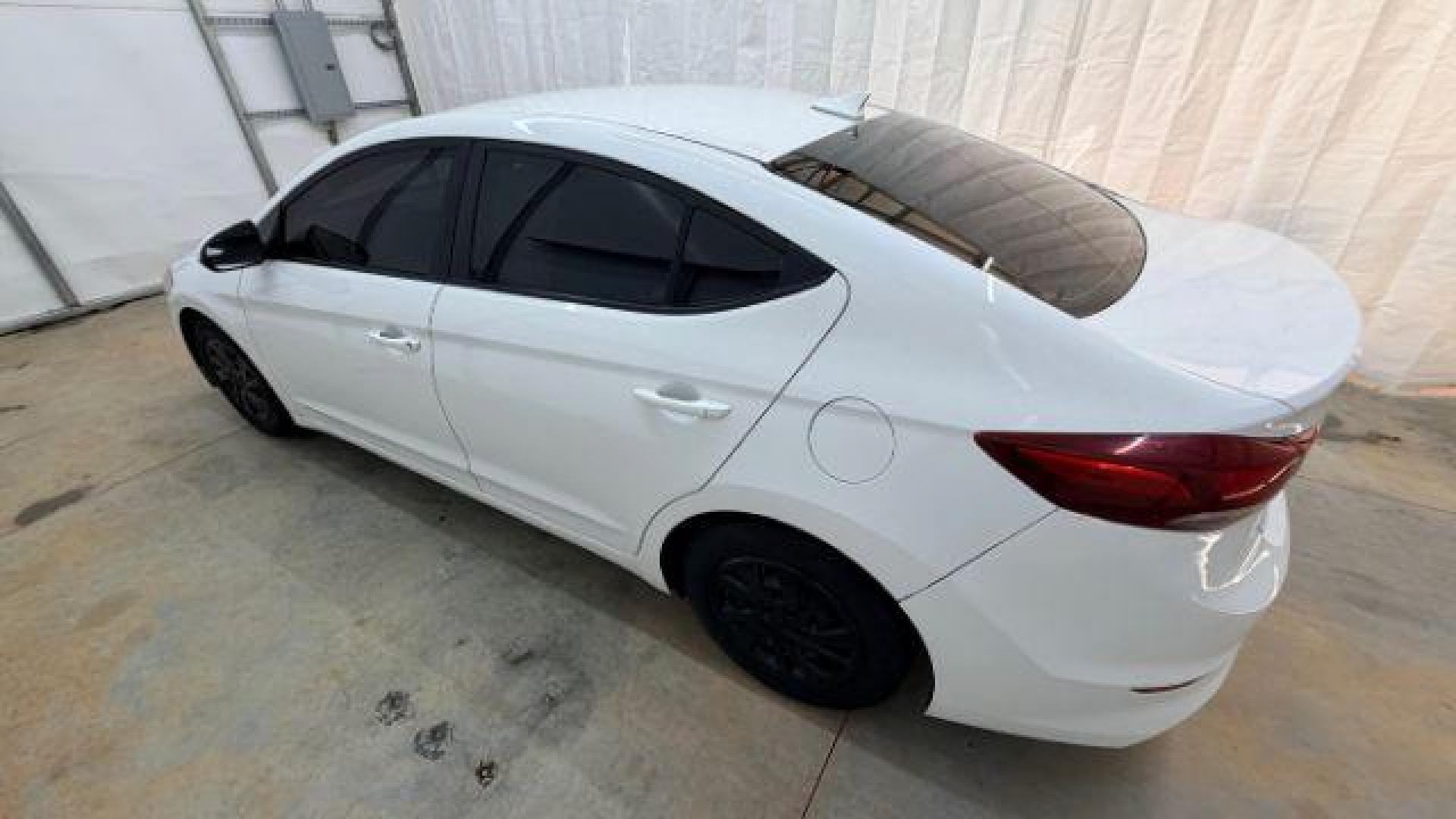 2017 White Hyundai Elantra SE 6AT (5NPD74LF3HH) with an 1.8L L4 DOHC 16V engine, 6-Speed Automatic transmission, located at 1806 Veterans Memorial Hwy SW, Austell, GA, 30168, (770) 944-9558, 33.817959, -84.606987 - Photo#2