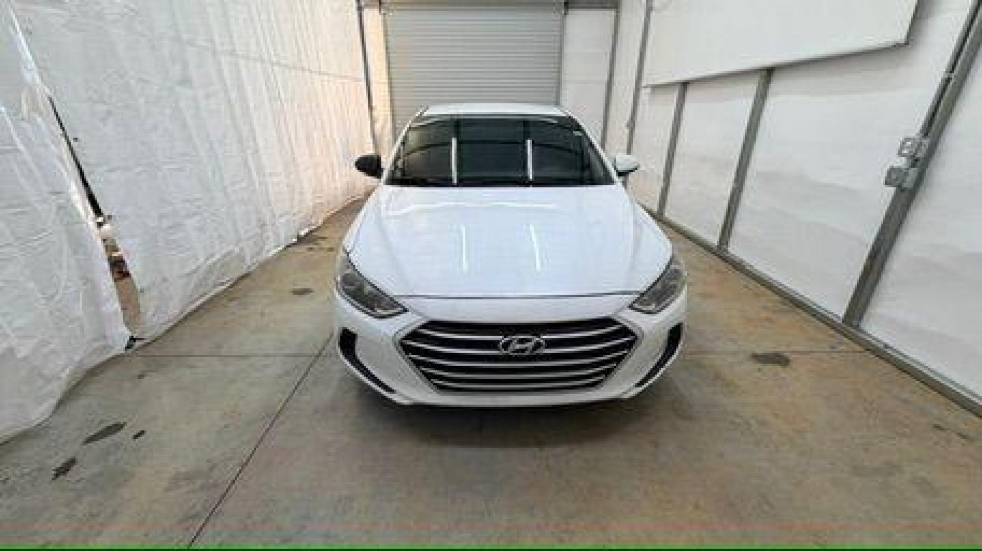 2017 White Hyundai Elantra SE 6AT (5NPD74LF3HH) with an 1.8L L4 DOHC 16V engine, 6-Speed Automatic transmission, located at 1806 Veterans Memorial Hwy SW, Austell, GA, 30168, (770) 944-9558, 33.817959, -84.606987 - Photo#9