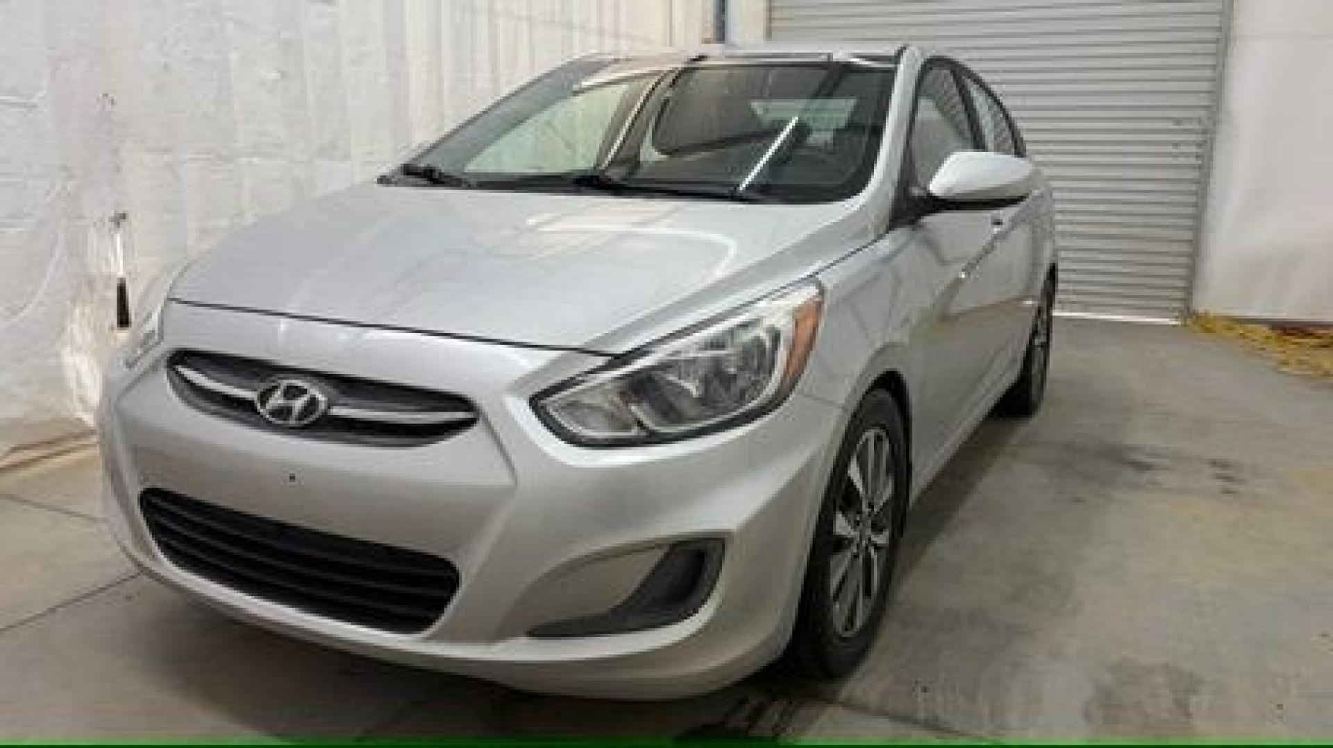 2017 Silver Hyundai Accent SE 4-Door 6A (KMHCT4AEXHU) with an 1.6L L4 DOHC 16V engine, 6-Speed Automatic transmission, located at 1806 Veterans Memorial Hwy SW, Austell, GA, 30168, (770) 944-9558, 33.817959, -84.606987- Photo#0