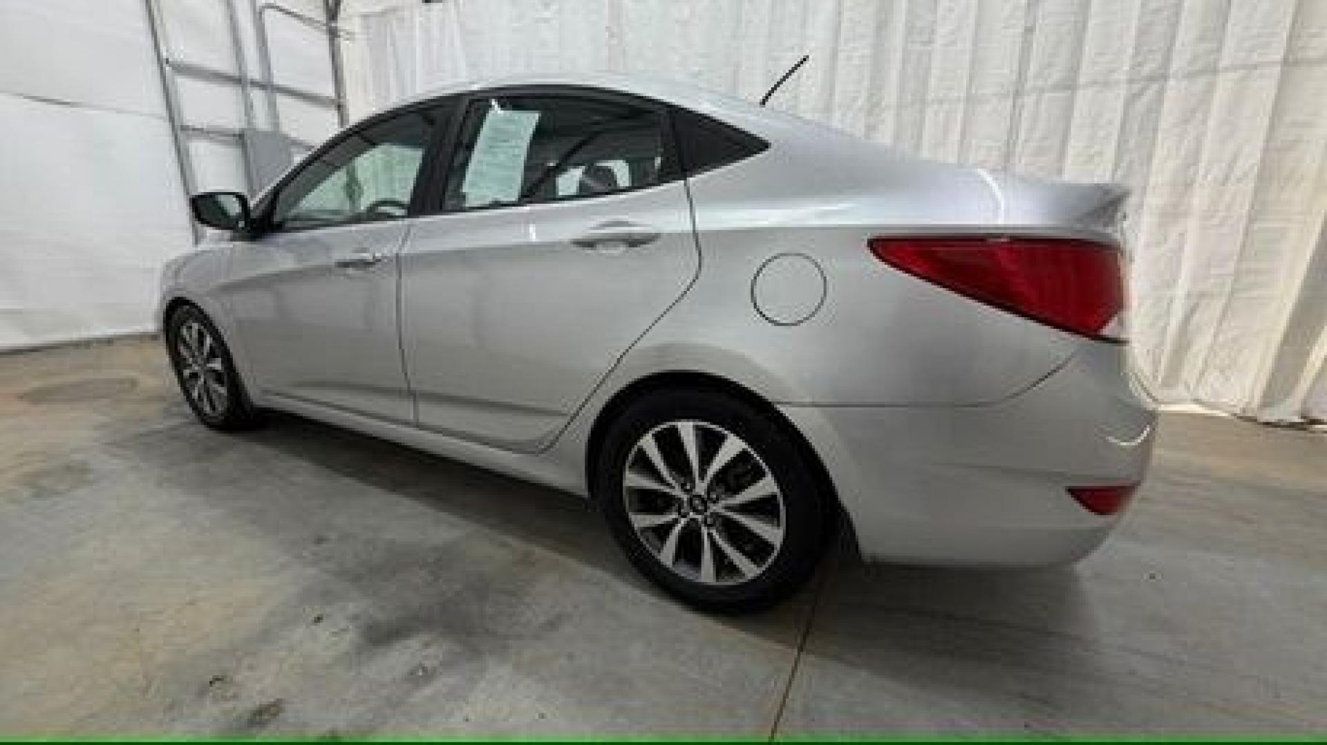 2017 Silver Hyundai Accent SE 4-Door 6A (KMHCT4AEXHU) with an 1.6L L4 DOHC 16V engine, 6-Speed Automatic transmission, located at 1806 Veterans Memorial Hwy SW, Austell, GA, 30168, (770) 944-9558, 33.817959, -84.606987- Photo#2