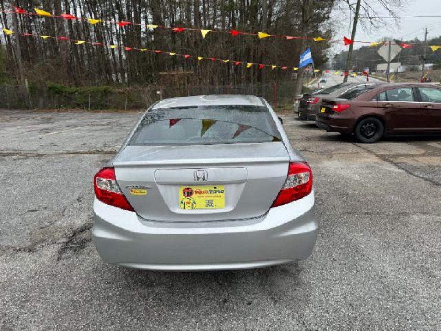 2012 Silver Honda Civic LX Sedan 5-Speed AT (2HGFB2F55CH) with an 1.8L L4 SOHC 16V engine, 5-Speed Automatic transmission, located at 1806 Veterans Memorial Hwy SW, Austell, GA, 30168, (770) 944-9558, 33.817959, -84.606987 - Photo#4