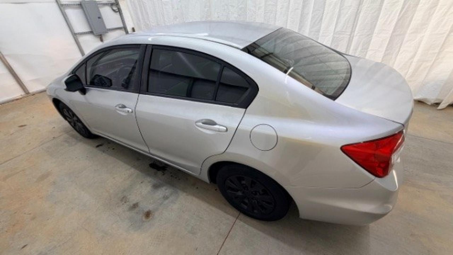 2012 Silver Honda Civic LX Sedan 5-Speed AT (2HGFB2F55CH) with an 1.8L L4 SOHC 16V engine, 5-Speed Automatic transmission, located at 1806 Veterans Memorial Hwy SW, Austell, GA, 30168, (770) 944-9558, 33.817959, -84.606987 - Photo#2
