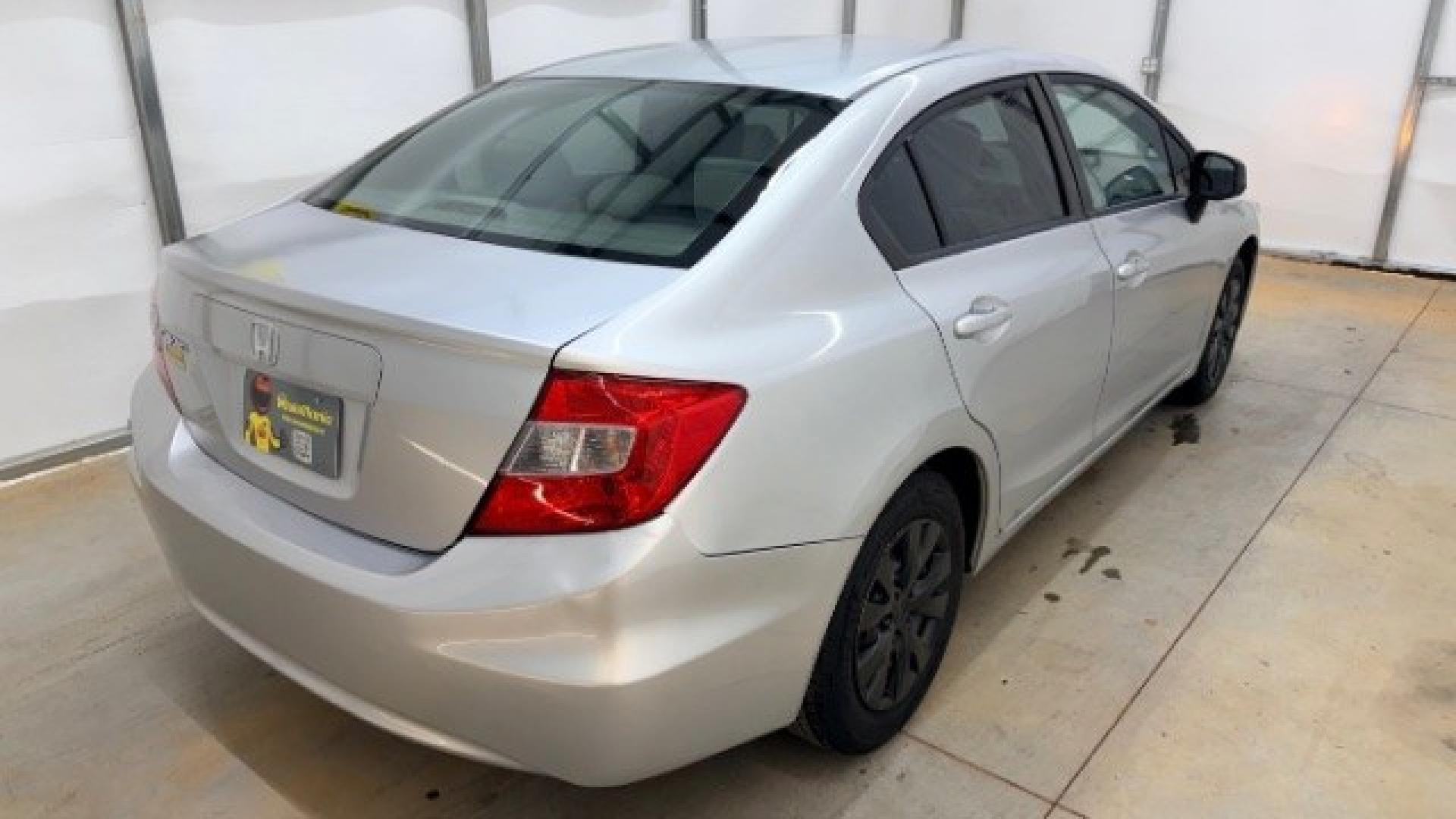 2012 Silver Honda Civic LX Sedan 5-Speed AT (2HGFB2F55CH) with an 1.8L L4 SOHC 16V engine, 5-Speed Automatic transmission, located at 1806 Veterans Memorial Hwy SW, Austell, GA, 30168, (770) 944-9558, 33.817959, -84.606987 - Photo#3