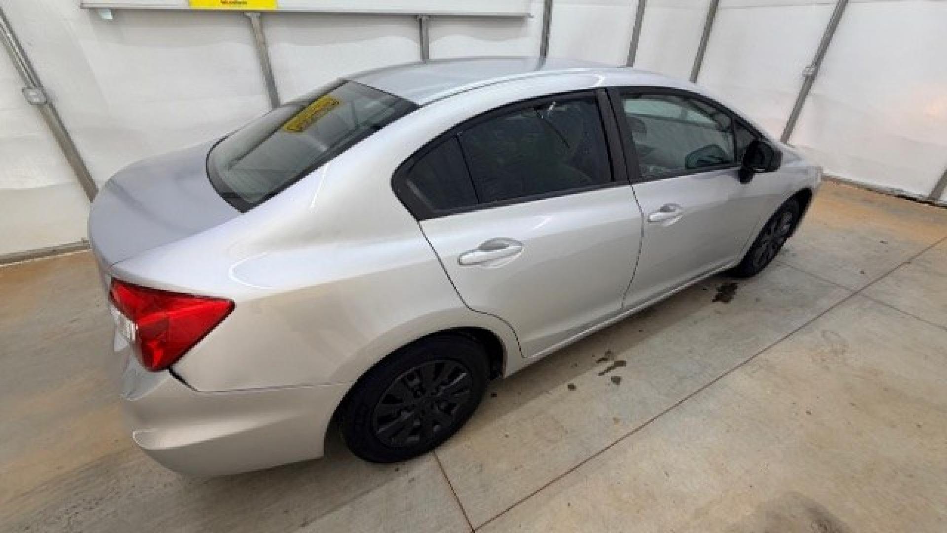2012 Silver Honda Civic LX Sedan 5-Speed AT (2HGFB2F55CH) with an 1.8L L4 SOHC 16V engine, 5-Speed Automatic transmission, located at 1806 Veterans Memorial Hwy SW, Austell, GA, 30168, (770) 944-9558, 33.817959, -84.606987 - Photo#4