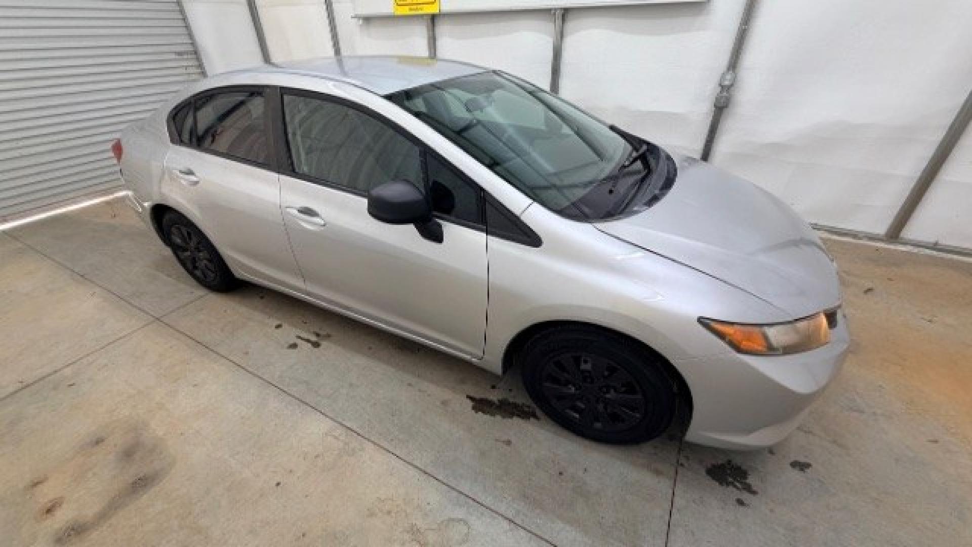 2012 Silver Honda Civic LX Sedan 5-Speed AT (2HGFB2F55CH) with an 1.8L L4 SOHC 16V engine, 5-Speed Automatic transmission, located at 1806 Veterans Memorial Hwy SW, Austell, GA, 30168, (770) 944-9558, 33.817959, -84.606987 - Photo#6