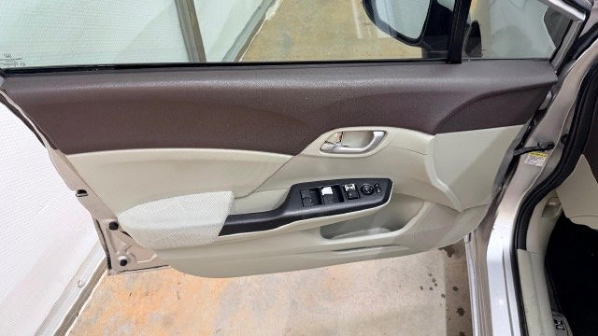 2012 Silver Honda Civic LX Sedan 5-Speed AT (2HGFB2F55CH) with an 1.8L L4 SOHC 16V engine, 5-Speed Automatic transmission, located at 1806 Veterans Memorial Hwy SW, Austell, GA, 30168, (770) 944-9558, 33.817959, -84.606987 - Photo#9