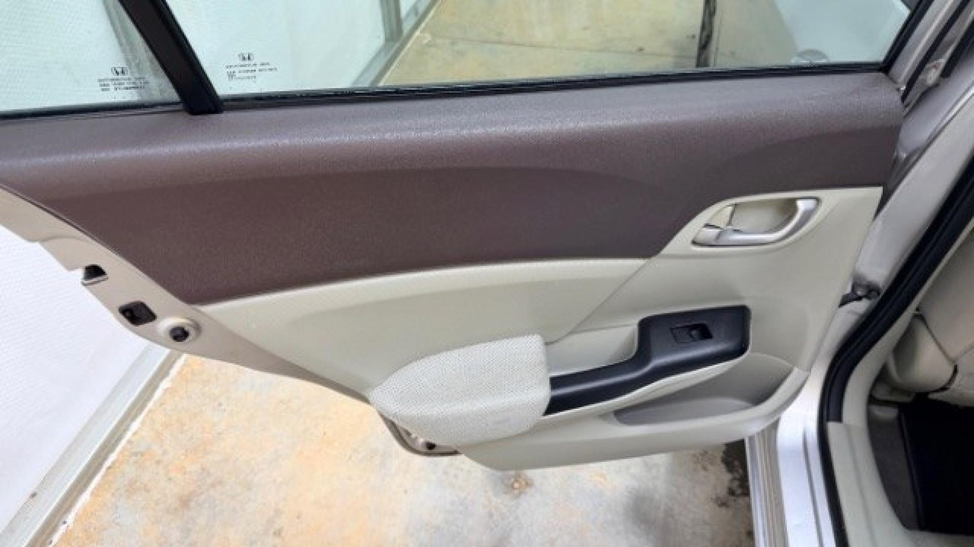 2012 Silver Honda Civic LX Sedan 5-Speed AT (2HGFB2F55CH) with an 1.8L L4 SOHC 16V engine, 5-Speed Automatic transmission, located at 1806 Veterans Memorial Hwy SW, Austell, GA, 30168, (770) 944-9558, 33.817959, -84.606987 - Photo#11