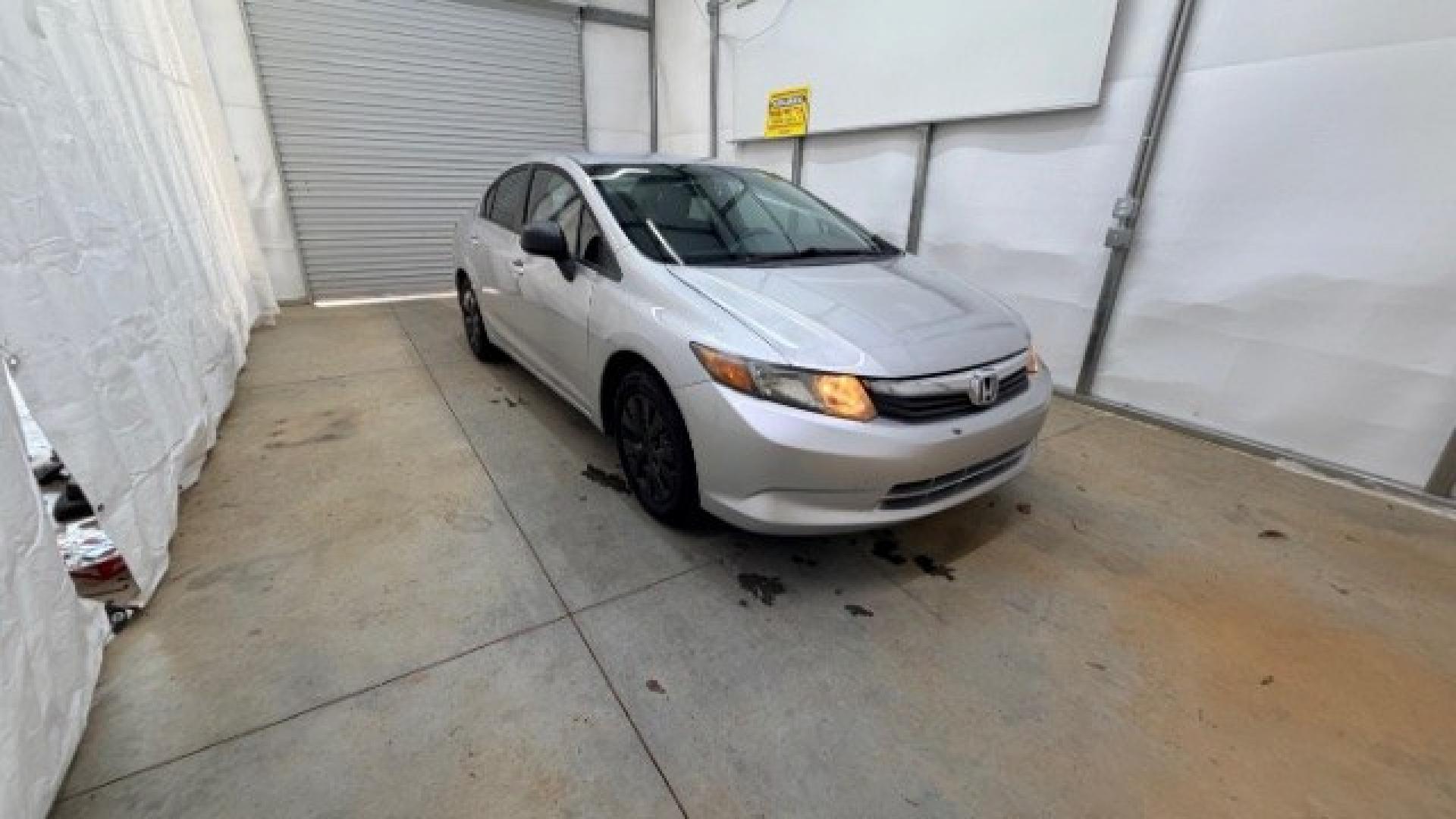 2012 Silver Honda Civic LX Sedan 5-Speed AT (2HGFB2F55CH) with an 1.8L L4 SOHC 16V engine, 5-Speed Automatic transmission, located at 1806 Veterans Memorial Hwy SW, Austell, GA, 30168, (770) 944-9558, 33.817959, -84.606987 - Photo#13