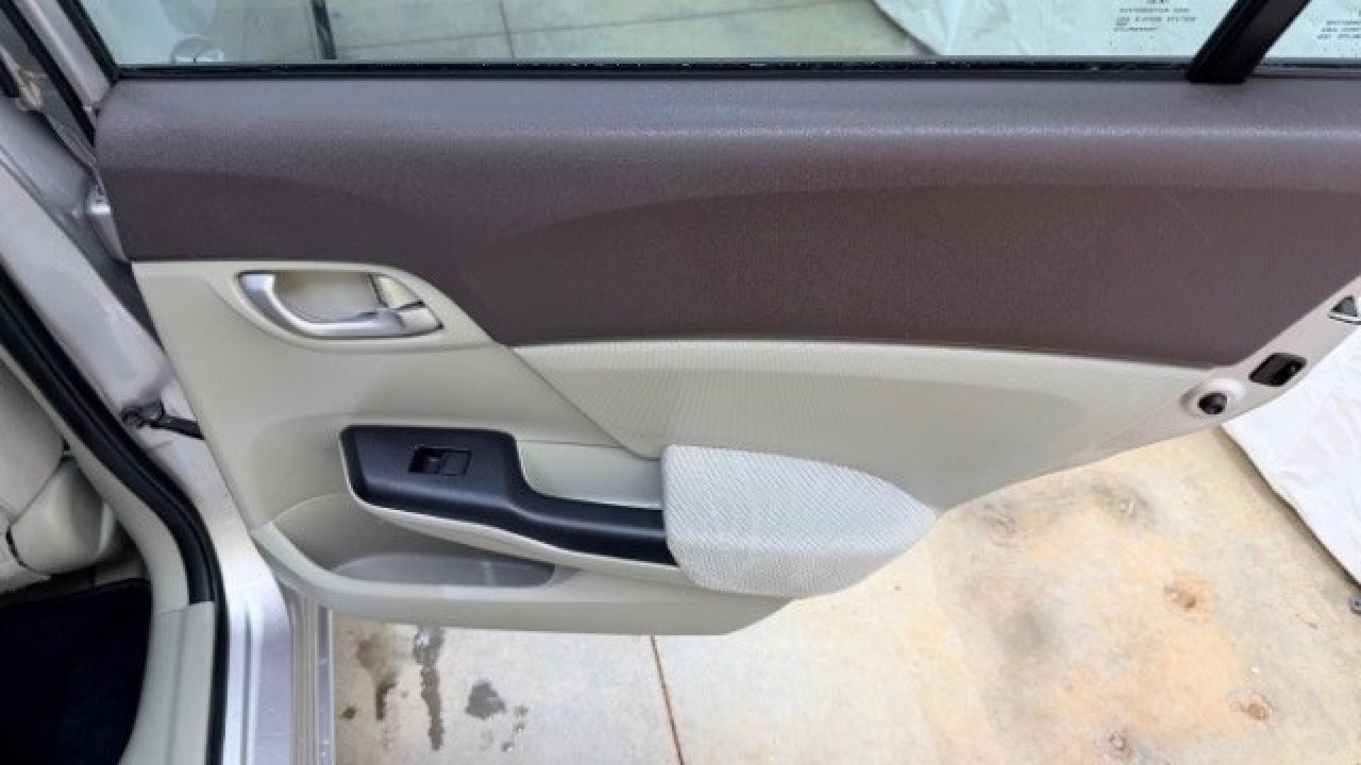 2012 Silver Honda Civic LX Sedan 5-Speed AT (2HGFB2F55CH) with an 1.8L L4 SOHC 16V engine, 5-Speed Automatic transmission, located at 1806 Veterans Memorial Hwy SW, Austell, GA, 30168, (770) 944-9558, 33.817959, -84.606987 - Photo#15