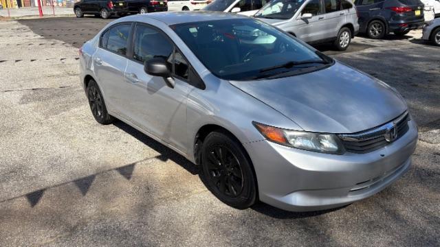 2012 Silver Honda Civic LX Sedan 5-Speed AT (2HGFB2F55CH) with an 1.8L L4 SOHC 16V engine, 5-Speed Automatic transmission, located at 1806 Veterans Memorial Hwy SW, Austell, GA, 30168, (770) 944-9558, 33.817959, -84.606987 - Photo#2