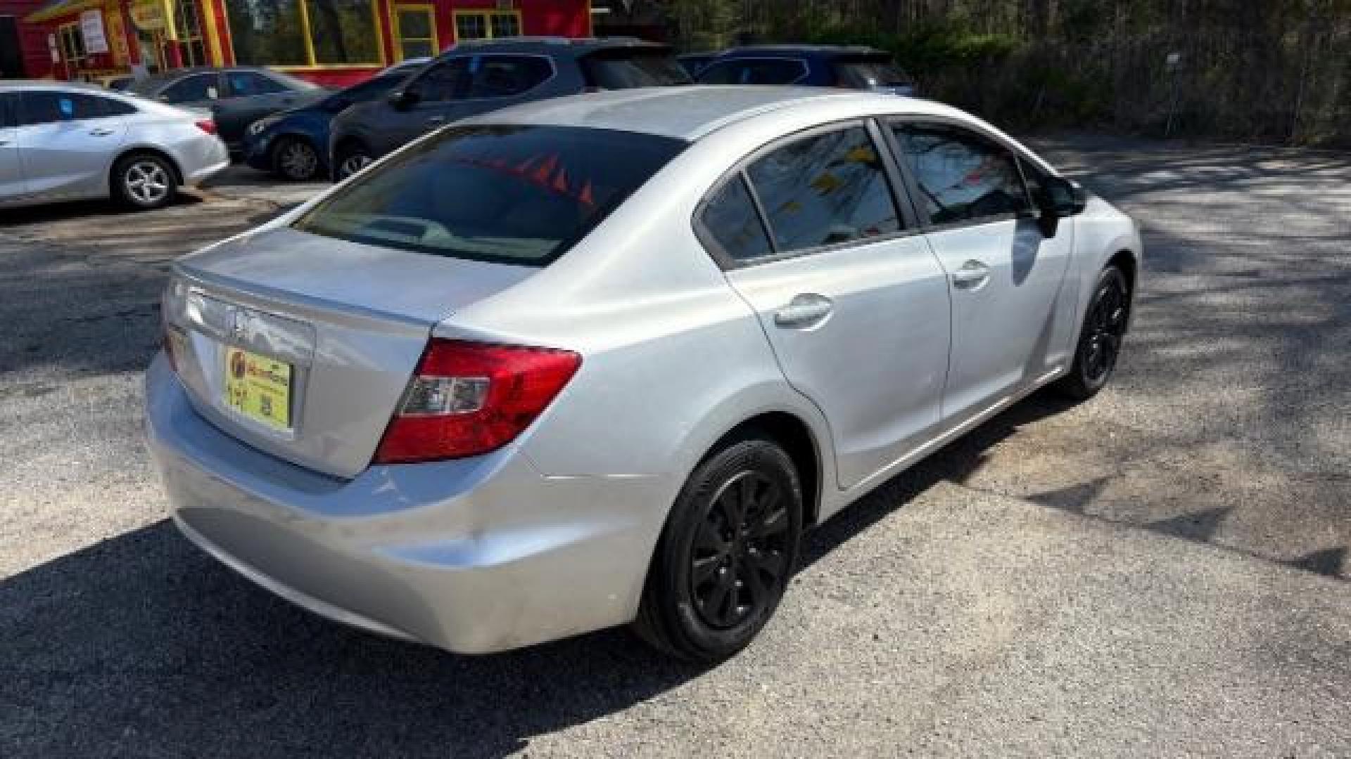 2012 Silver Honda Civic LX Sedan 5-Speed AT (2HGFB2F55CH) with an 1.8L L4 SOHC 16V engine, 5-Speed Automatic transmission, located at 1806 Veterans Memorial Hwy SW, Austell, GA, 30168, (770) 944-9558, 33.817959, -84.606987 - Photo#3