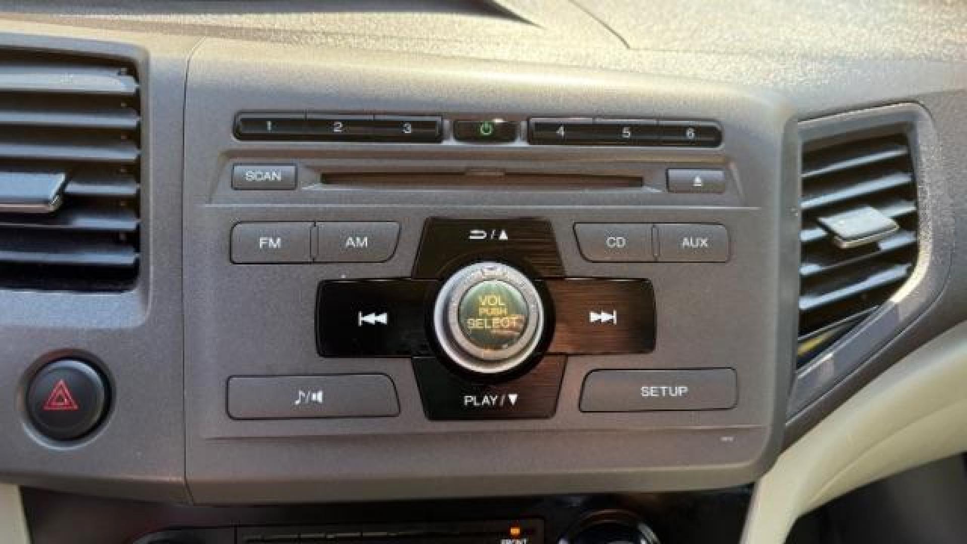 2012 Silver Honda Civic LX Sedan 5-Speed AT (2HGFB2F55CH) with an 1.8L L4 SOHC 16V engine, 5-Speed Automatic transmission, located at 1806 Veterans Memorial Hwy SW, Austell, GA, 30168, (770) 944-9558, 33.817959, -84.606987 - Photo#12