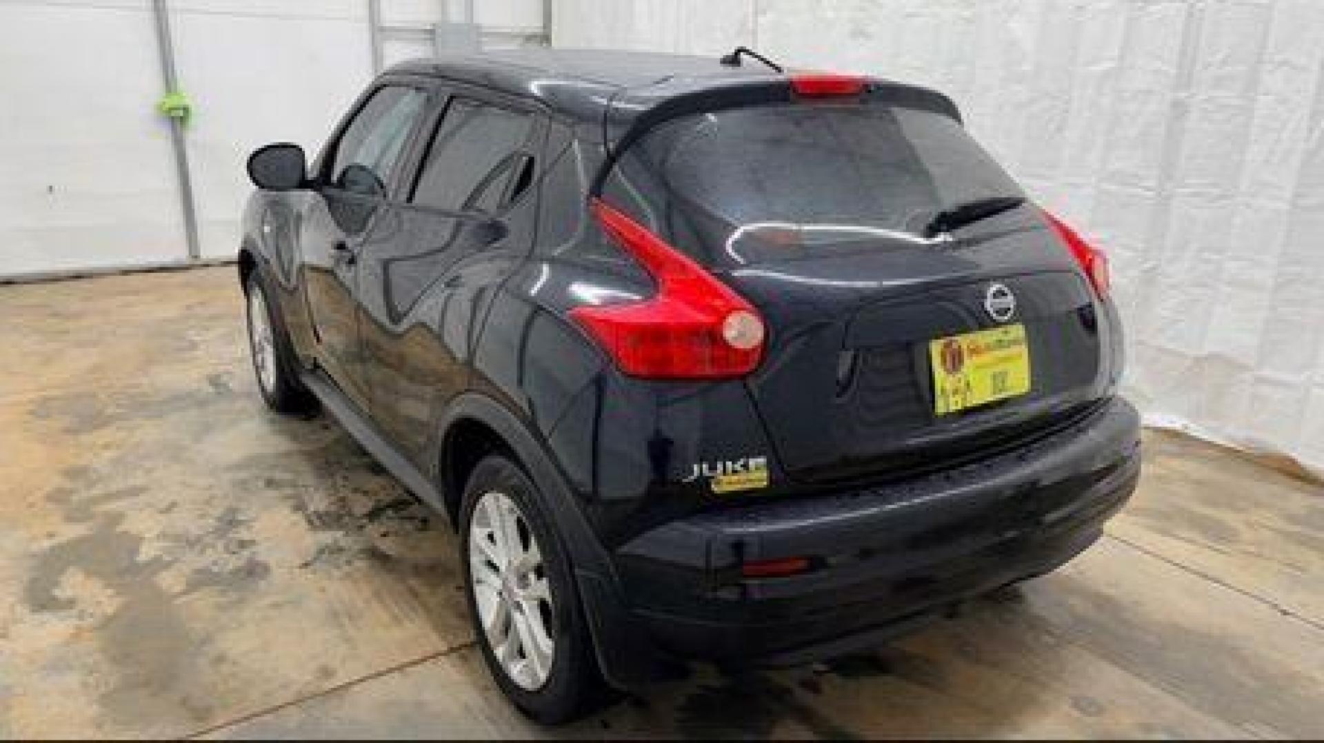 2014 Black Nissan Juke S FWD (JN8AF5MRXET) with an 1.6L L4 DOHC 16V TURBO engine, Continuously Variable Transmission transmission, located at 1806 Veterans Memorial Hwy SW, Austell, GA, 30168, (770) 944-9558, 33.817959, -84.606987 - Photo#3
