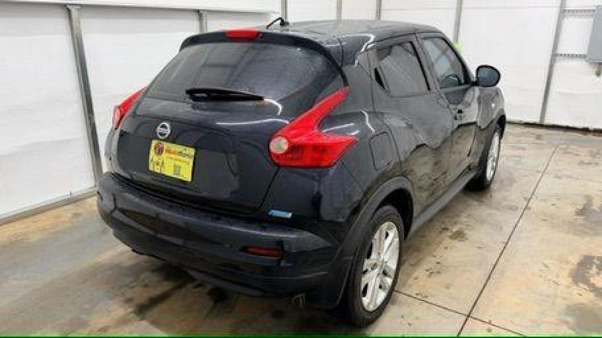 2014 Black Nissan Juke S FWD (JN8AF5MRXET) with an 1.6L L4 DOHC 16V TURBO engine, Continuously Variable Transmission transmission, located at 1806 Veterans Memorial Hwy SW, Austell, GA, 30168, (770) 944-9558, 33.817959, -84.606987 - Photo#5