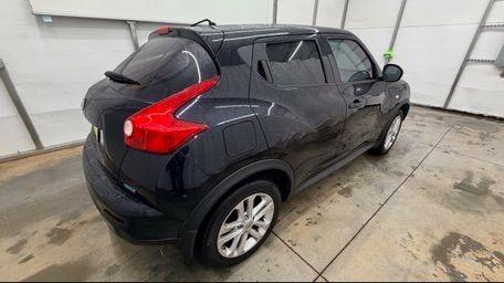 2014 Black Nissan Juke S FWD (JN8AF5MRXET) with an 1.6L L4 DOHC 16V TURBO engine, Continuously Variable Transmission transmission, located at 1806 Veterans Memorial Hwy SW, Austell, GA, 30168, (770) 944-9558, 33.817959, -84.606987 - Photo#6