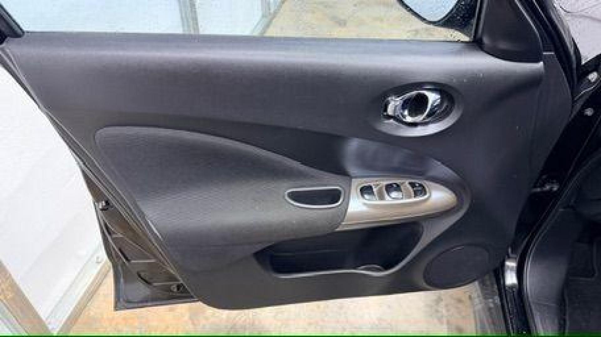 2014 Black Nissan Juke S FWD (JN8AF5MRXET) with an 1.6L L4 DOHC 16V TURBO engine, Continuously Variable Transmission transmission, located at 1806 Veterans Memorial Hwy SW, Austell, GA, 30168, (770) 944-9558, 33.817959, -84.606987 - Photo#9